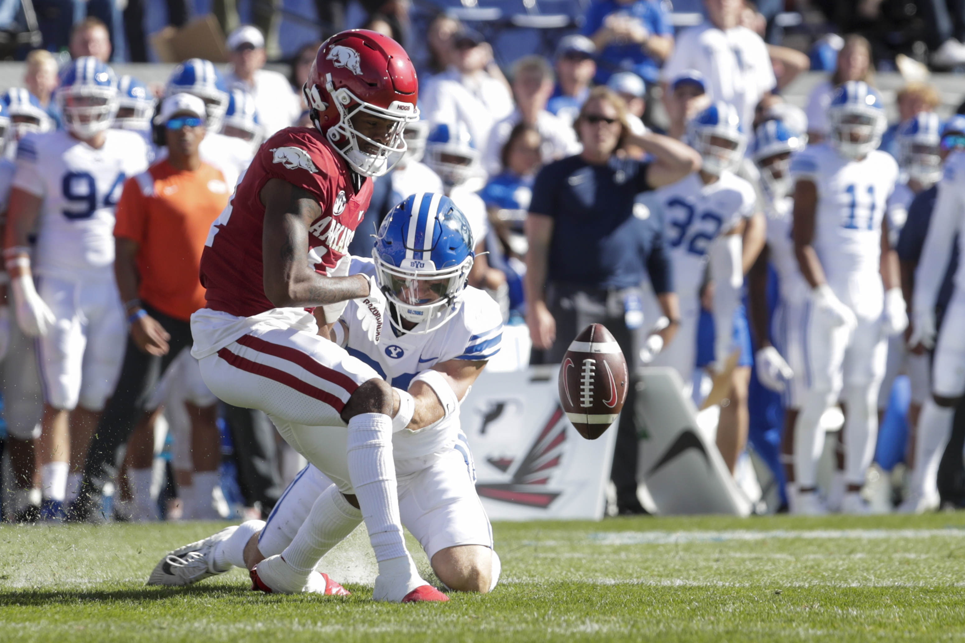 Bryce Stephens (14) of the Arkansas Razorbacks drops a pass while be defended by Ethan Slade (26) of the BYU Cougars in Provo on Saturday, Oct. 15, 2022.