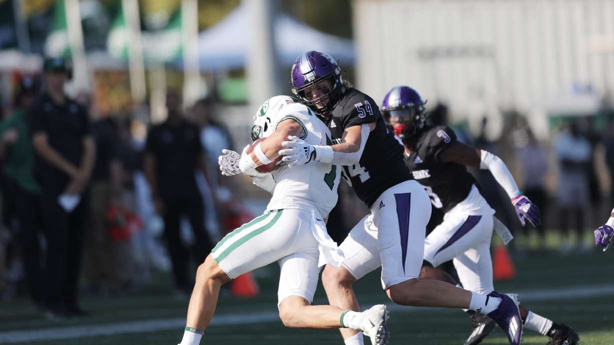 Weber State linebacker Garrett Beck makes a tackle in a game against Portland State on Oct. 15, 2022.