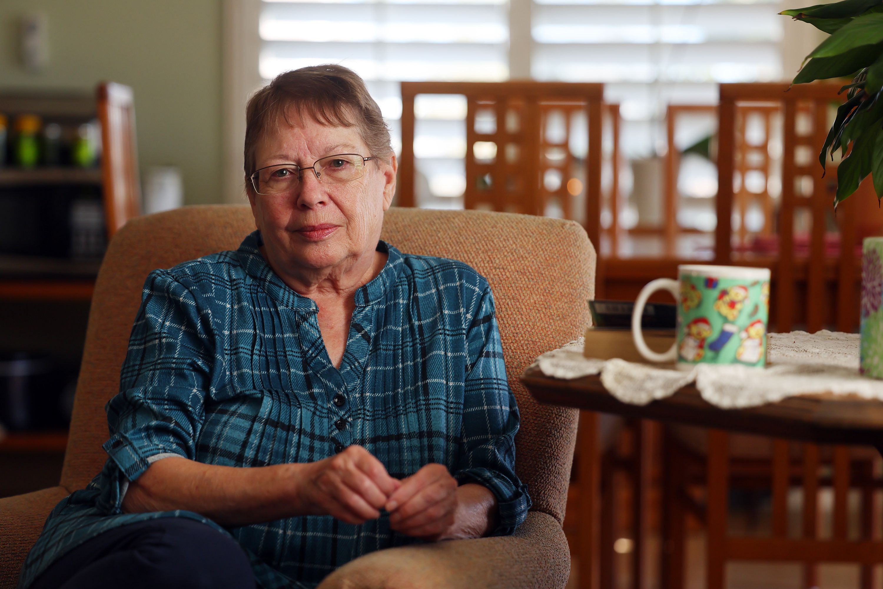 Barbara Person poses for a photo in her home in West Valley City on Friday. Person says she isn’t overly concerned with COVID-19 and this year’s flu season.