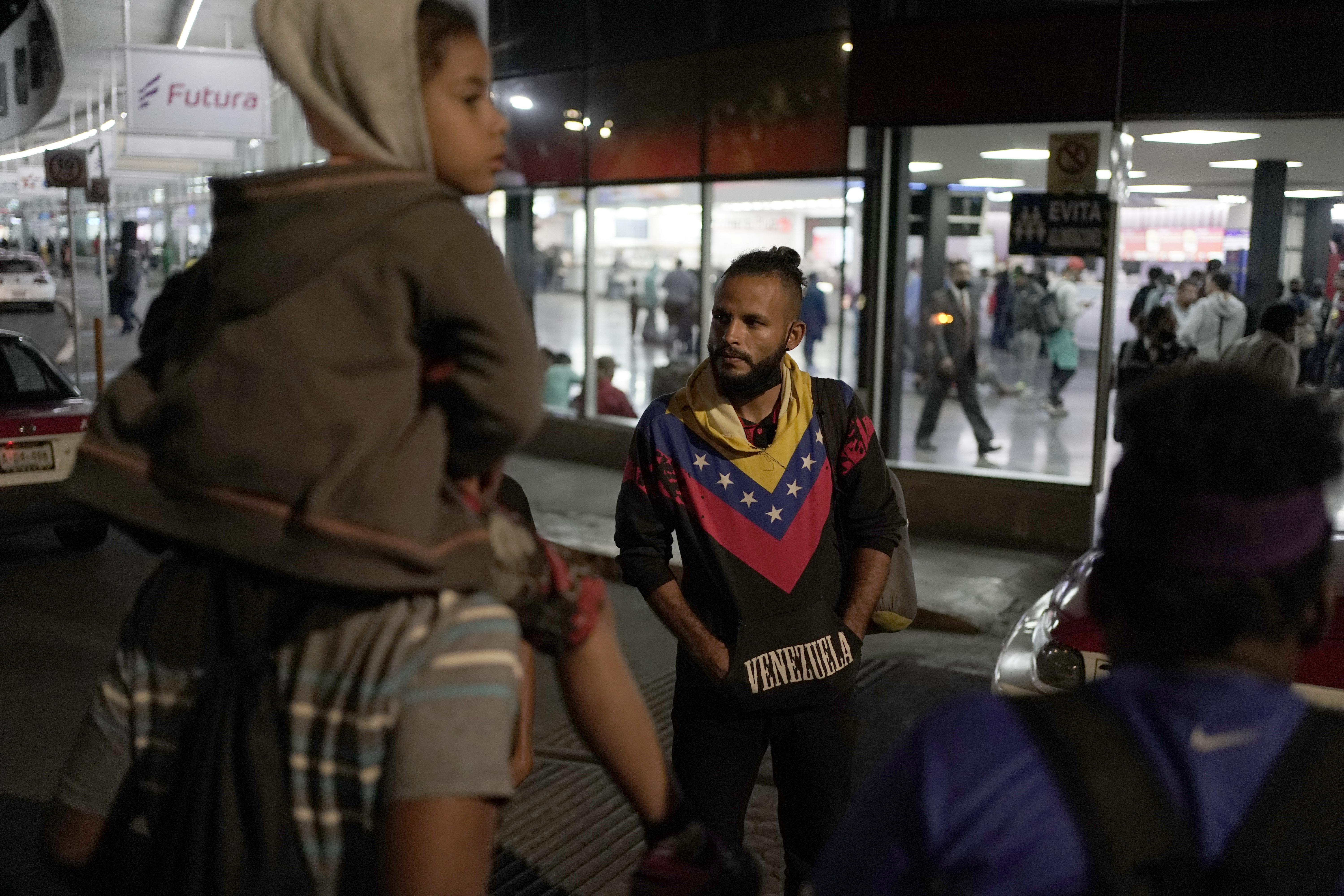 Venezuelan migrants wait for a bus to take them north, at the Northern Bus Station in Mexico City on Thursday. President Joe Biden last week invoked a Trump-era rule known as Title 42, which Biden's own Justice Department is fighting in court, to deny Venezuelans fleeing their crisis-torn country the chance to request asylum at the border.