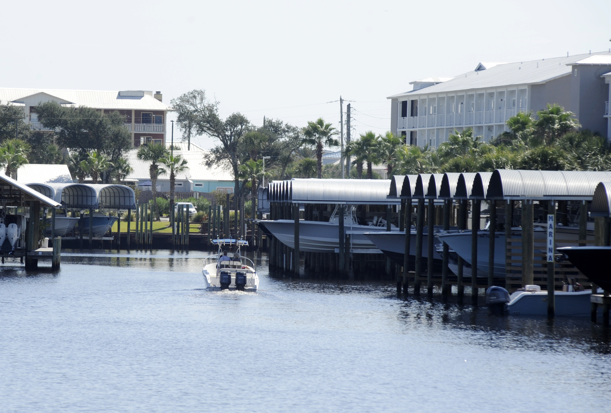 A boat cruises through a marina in rebuilt Mexico Beach, Fla., on Tuesday. Destroyed by Hurricane Michael, the Florida Panhandle community is still rebuilding four years later.