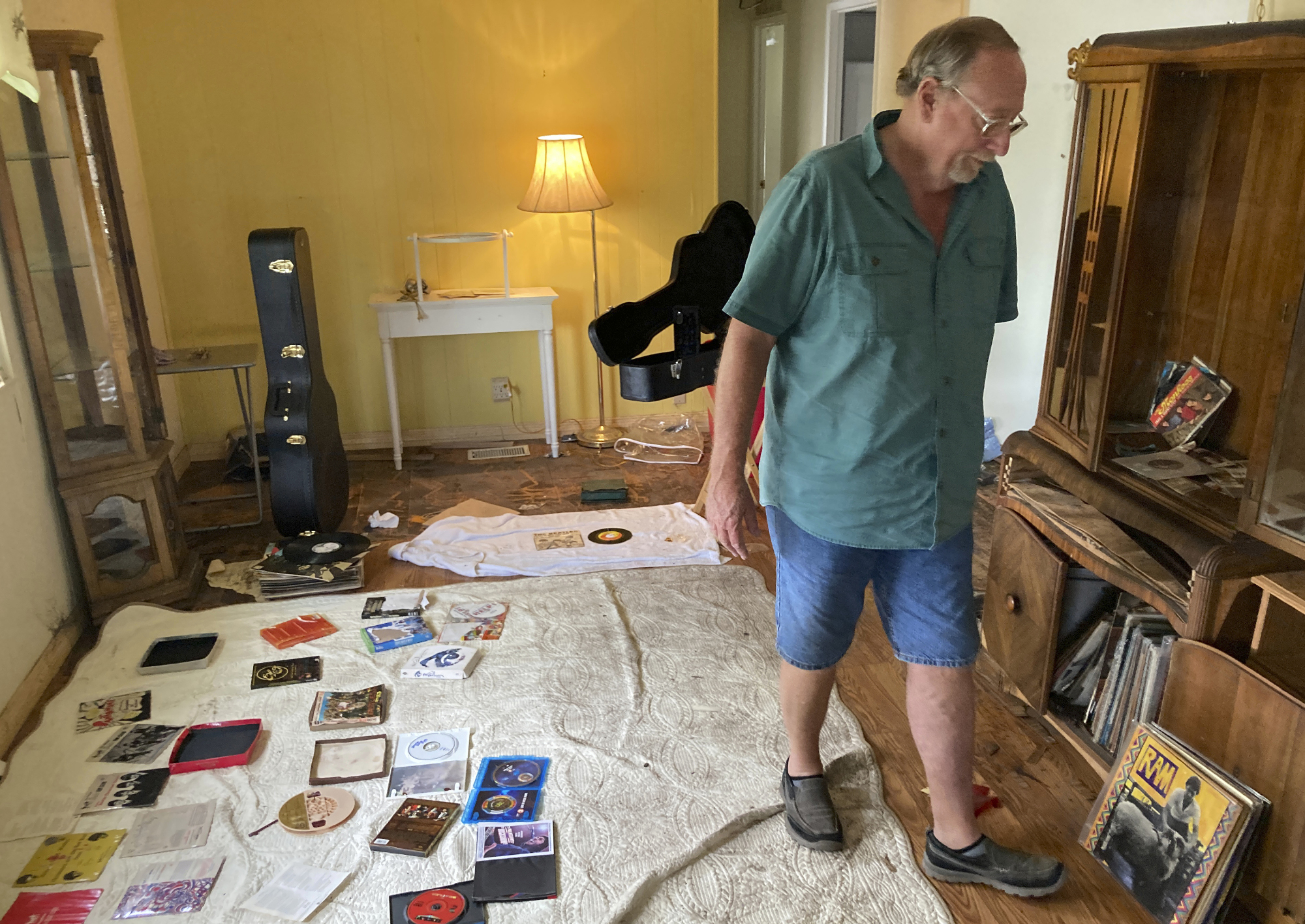 Mike Ford, whose home was flooded by Hurricane Ian, stands inside his residence in Fort Myers, Fla., Sunday. Southwest Florida is getting some advice from the Florida Panhandle, which was struck by Hurricane Michael in 2018, as it moves ahead following Ian.