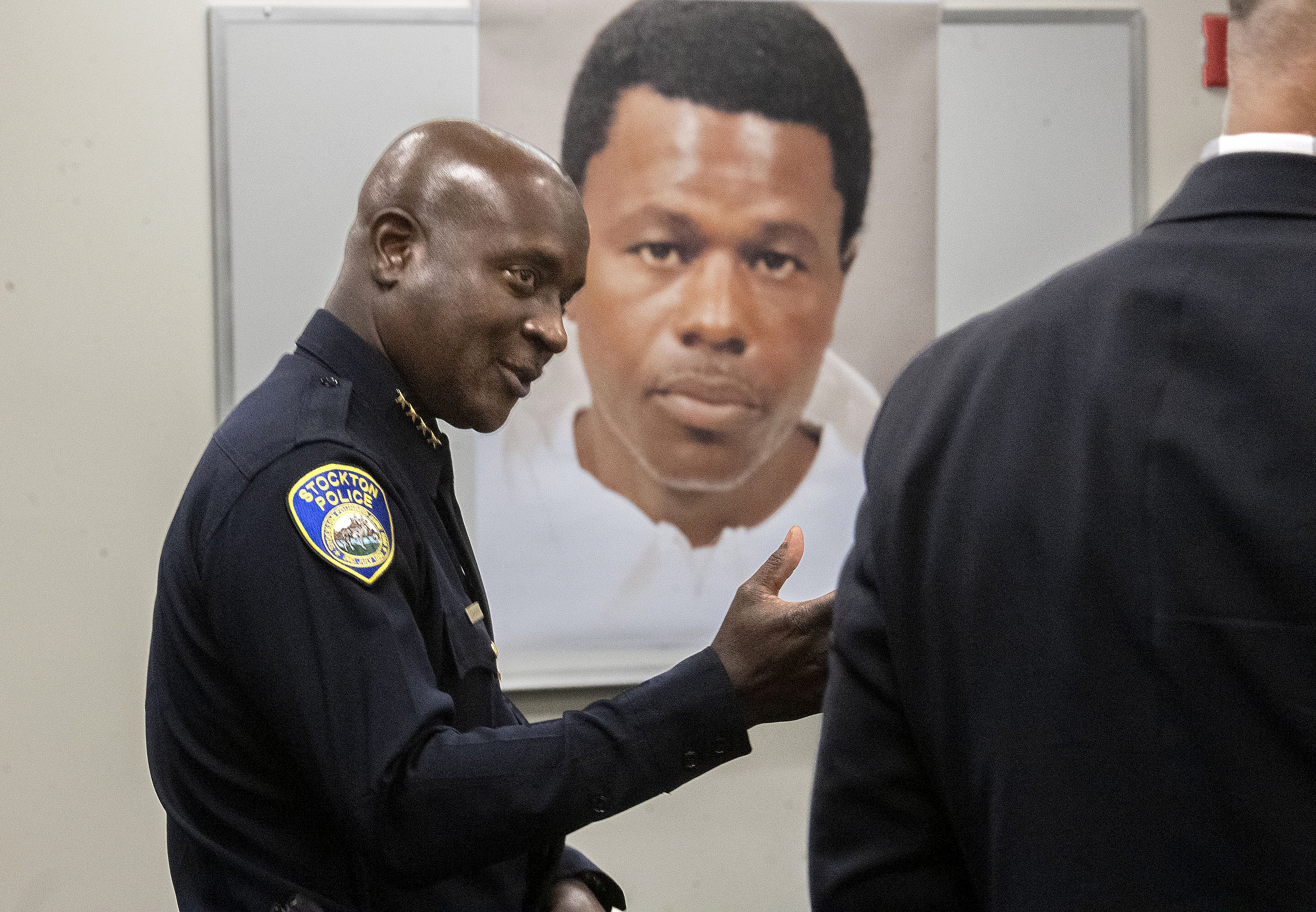 Stockton Police Chief Stanley McFadden speaks during a press conference at the Stockton Police Department headquarters in Stockton, Calif., on the arrest of suspect Wesley Brownlee in the Stockton serial killings on Saturday. Behind McFadden is a booking photo of Brownlee. 