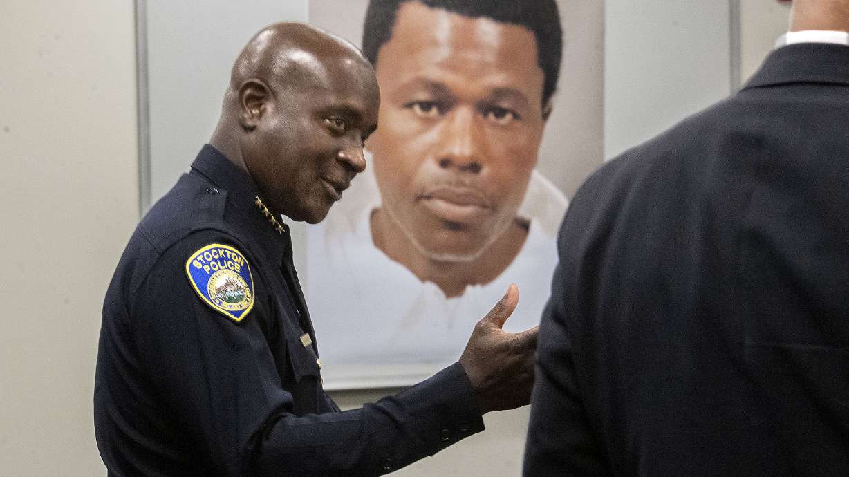 Stockton Police Chief Stanley McFadden speaks during a press conference at the Stockton Police Department headquarters in Stockton, Calif., on the arrest of suspect Wesley Brownlee in the Stockton serial killings on Saturday. Behind McFadden is a booking photo of Brownlee.