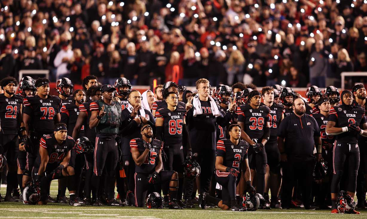 Players and fans stand and honor former players Ty Jordan and Aaron Lowe at the beginning of the fourth quarter as Utah and USC play at Rice Eccles Stadium in Salt Lake City on Saturday, Oct. 15, 2022. Utah won 43-42.