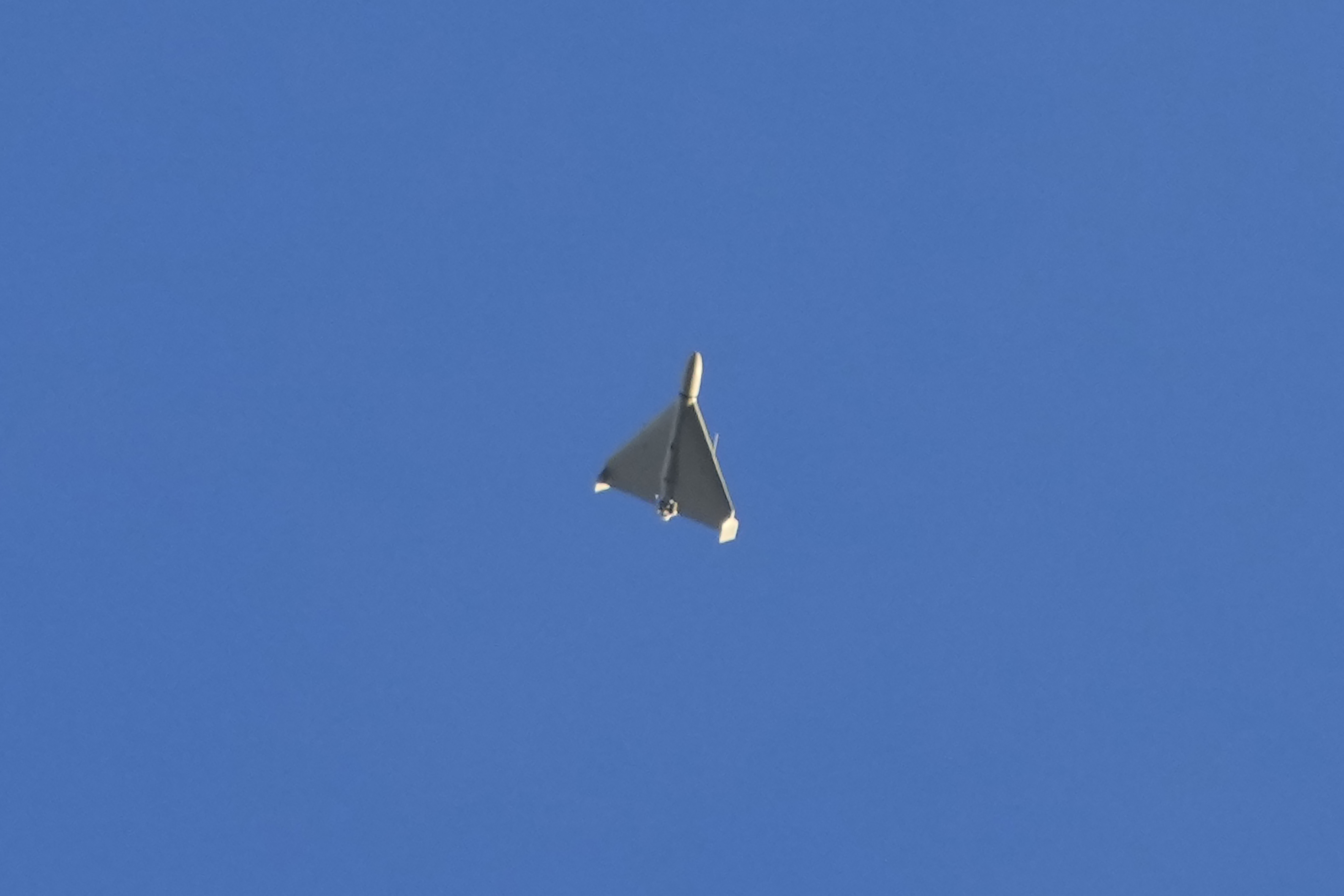 A drone is seen in the sky seconds before it fired on buildings in Kyiv, Ukraine, Monday.
