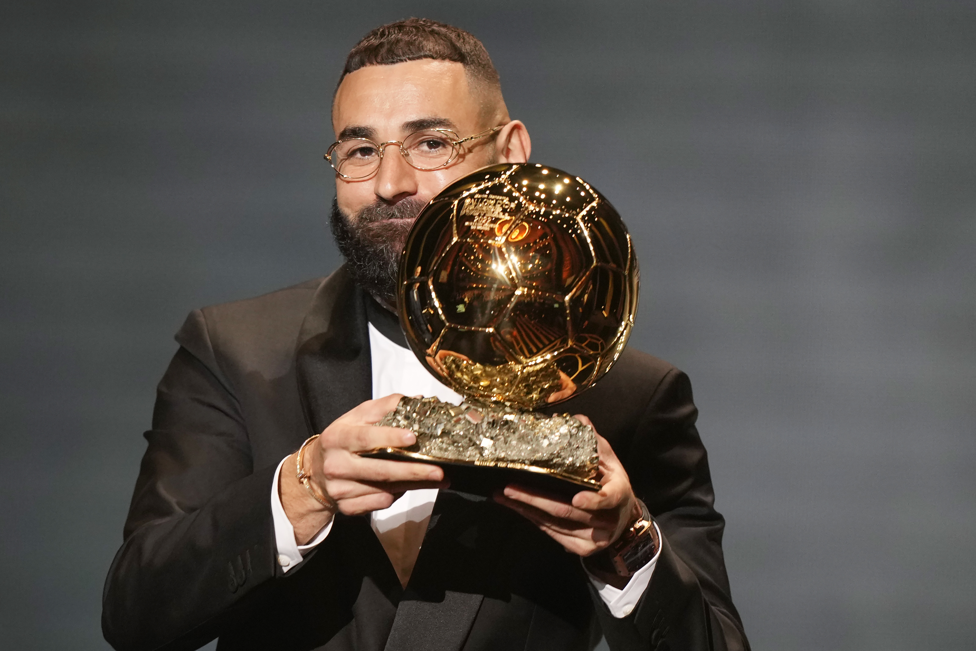 Real Madrid's Karim Benzema celebrates after winning the 2022 Ballon d'Or trophy during the 66th Ballon d'Or ceremony at Theatre du Chatelet in Paris, France, Monday, Oct. 17, 2022. 