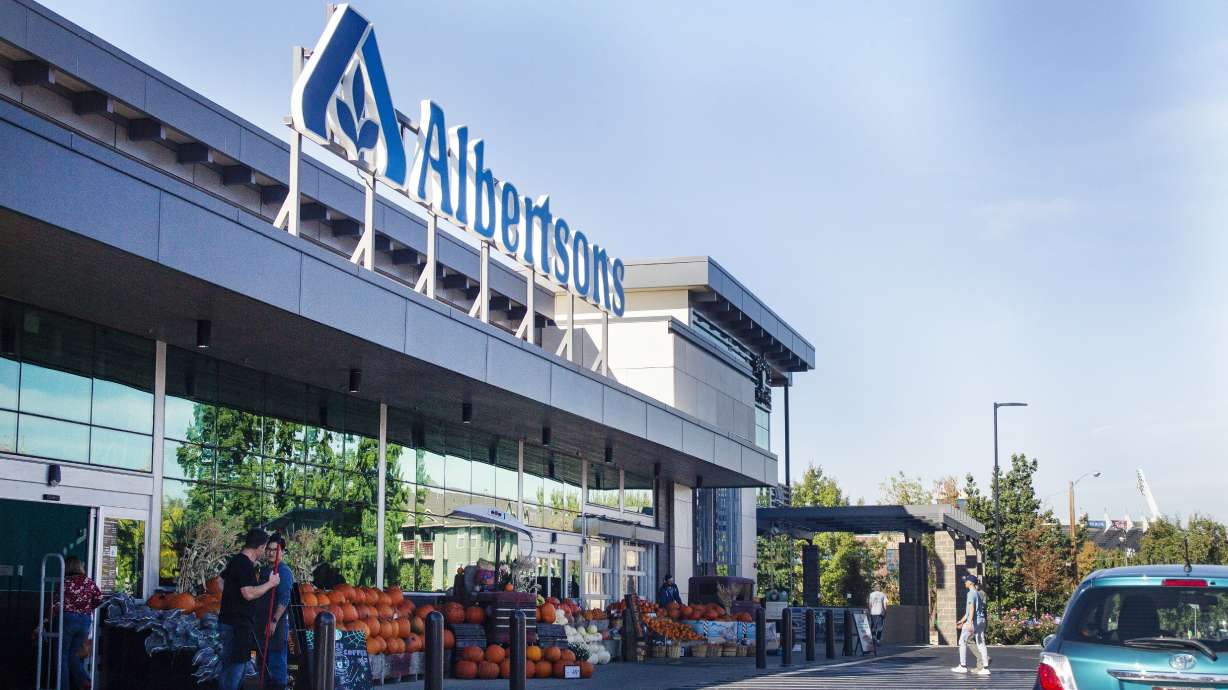 An Albertson's grocery store is pictured in Boise on Oct. 13. On Friday, Albertsons and Kroger, two of the nation’s largest grocers, announced they have agreed to merge in a deal they say would help them better compete with Walmart, Amazon and other major companies that have stepped into the grocery business.