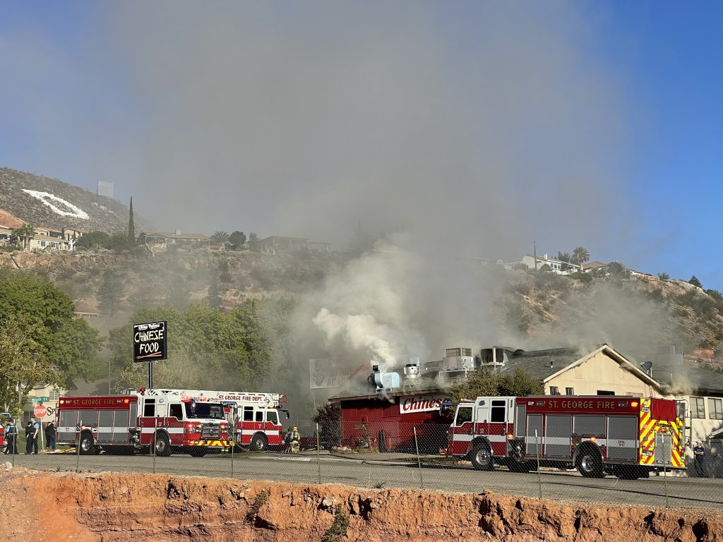 Smoke rises into the sky over China Palace in St. George, Monday.