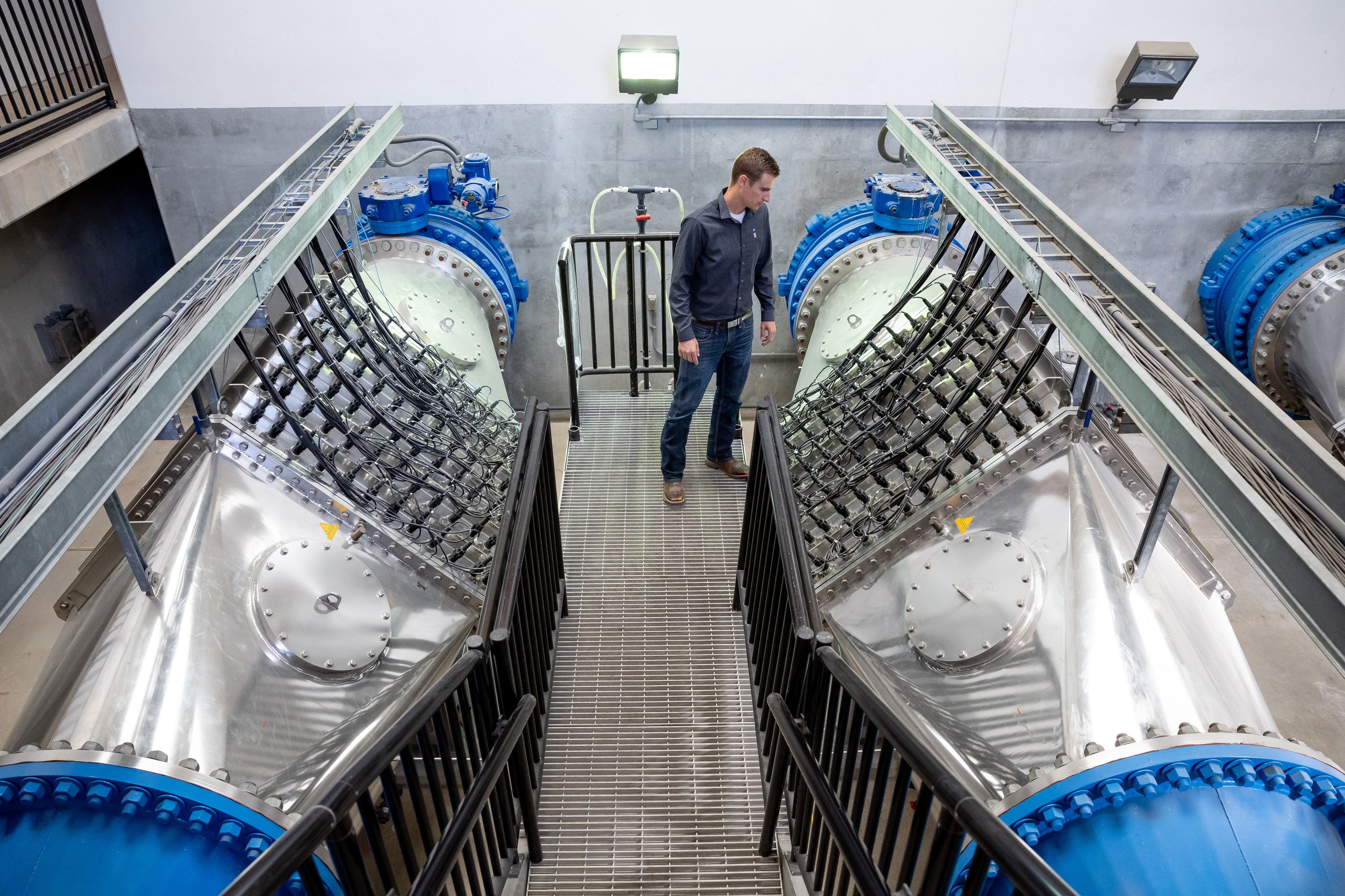 Josh Hogge, Municipal and Industrial Water Department manager for the Weber Basin Water Conservancy District, poses next to the ultra-violet light sanitization system at the district’s Davis North Water Treatment Plant in Layton on Oct. 17.