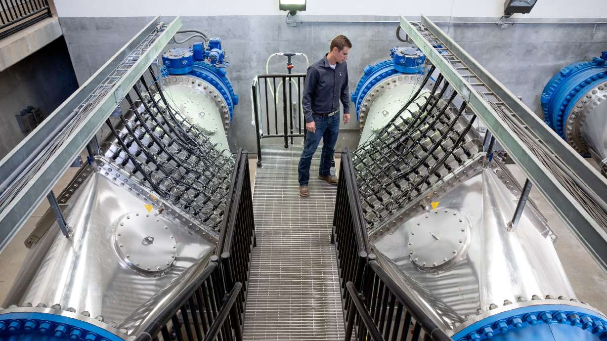 Josh Hogge, Municipal and Industrial Water Department manager for the Weber Basin Water Conservancy District, poses next to the ultra-violet light sanitization system at the district’s Davis North Water Treatment Plant in Layton on Oct. 17.