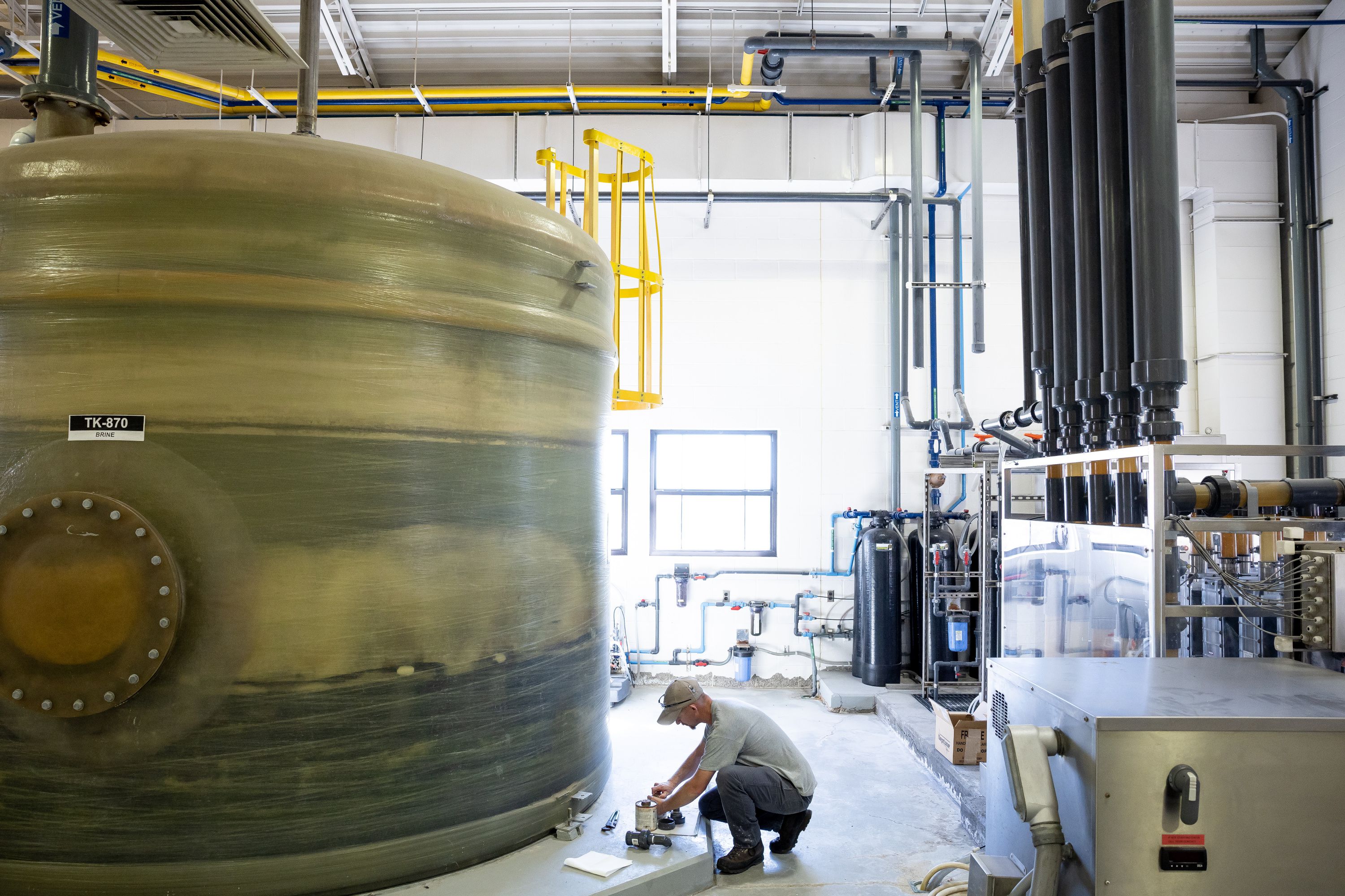 Adam Moulding, a maintenance worker at the Weber Basin Water Conservancy District’s Davis North Water Treatment Plant in Layton, assembles a valve at the plant on Oct. 17.