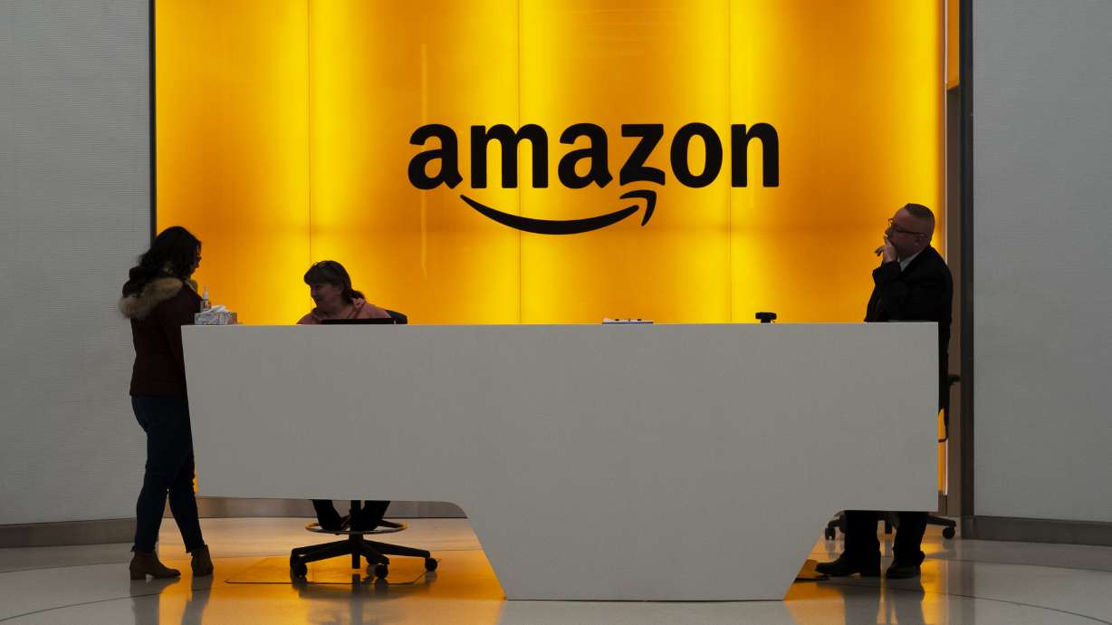 People stand in the lobby of Amazon offices on Feb. 14, 2019, in New York.