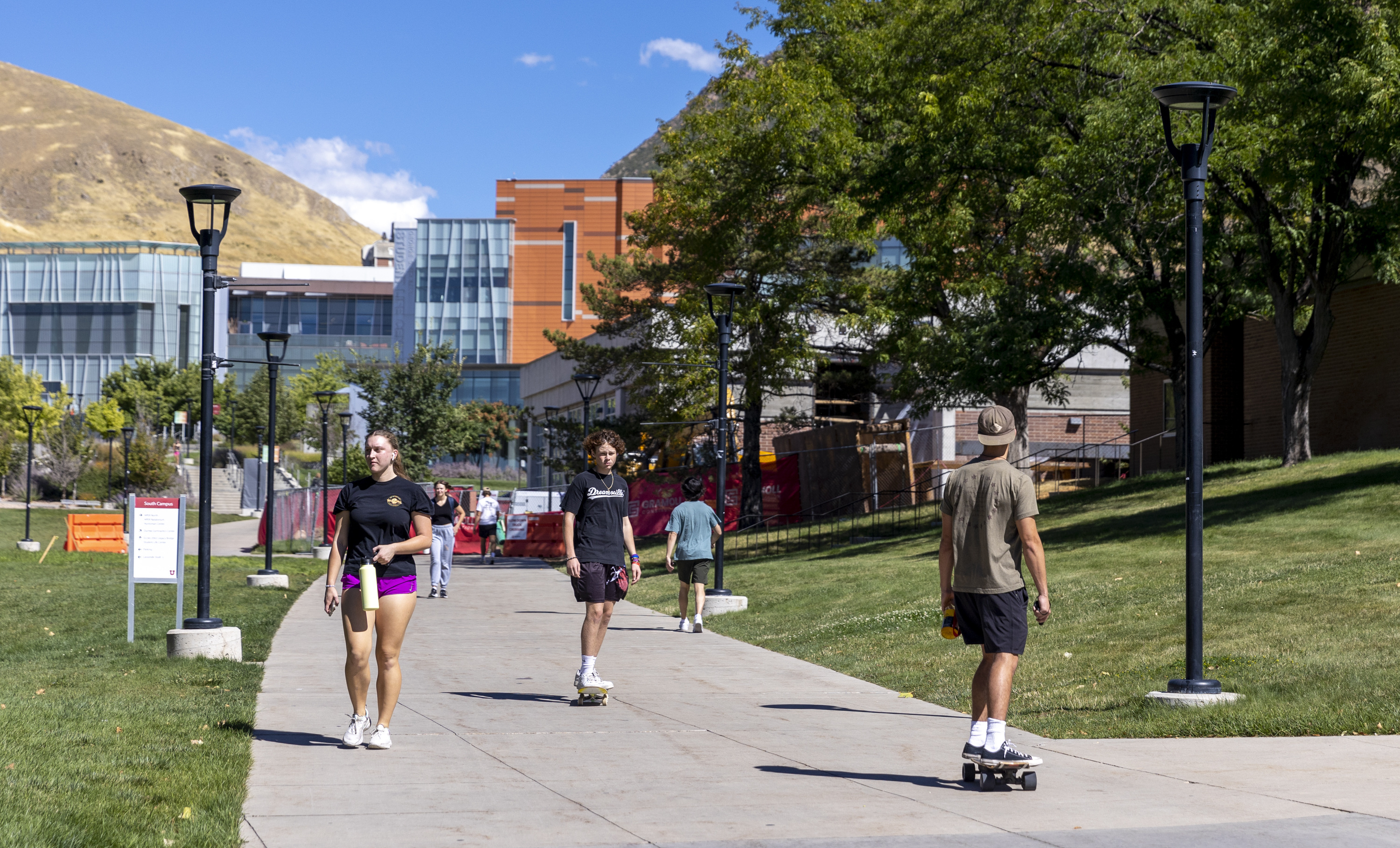 Campusgoers move about on the University of Utah campus in Salt Lake City on Sept. 18. The Utah System of Higher Education on Monday released annual data that shows which colleges and universities are gaining students and which ones are losing them.