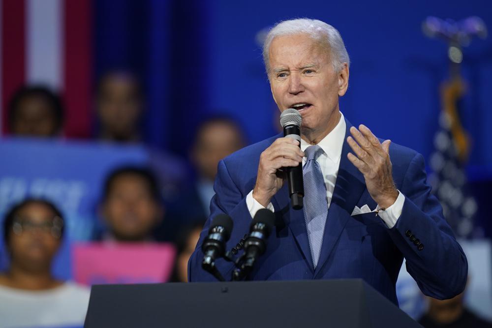 President Joe Biden speaks about abortion access during a Democratic National Committee event, Tuesday, at the Howard Theatre in Washington. Biden, under renewed pressure over high inflation with mid-term elections approaching, said on Tuesday he will sign a law to codify abortion rights in January if Democrats control the legislature next year.