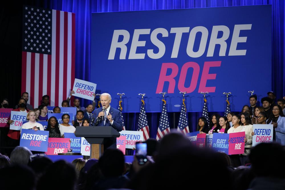 President Joe Biden speaks about abortion access during a Democratic National Committee event, Tuesday, at the Howard Theatre in Washington. Biden, under renewed pressure over high inflation with mid-term elections approaching, said on Tuesday he will sign a law to codify abortion rights in January if Democrats control the legislature next year.