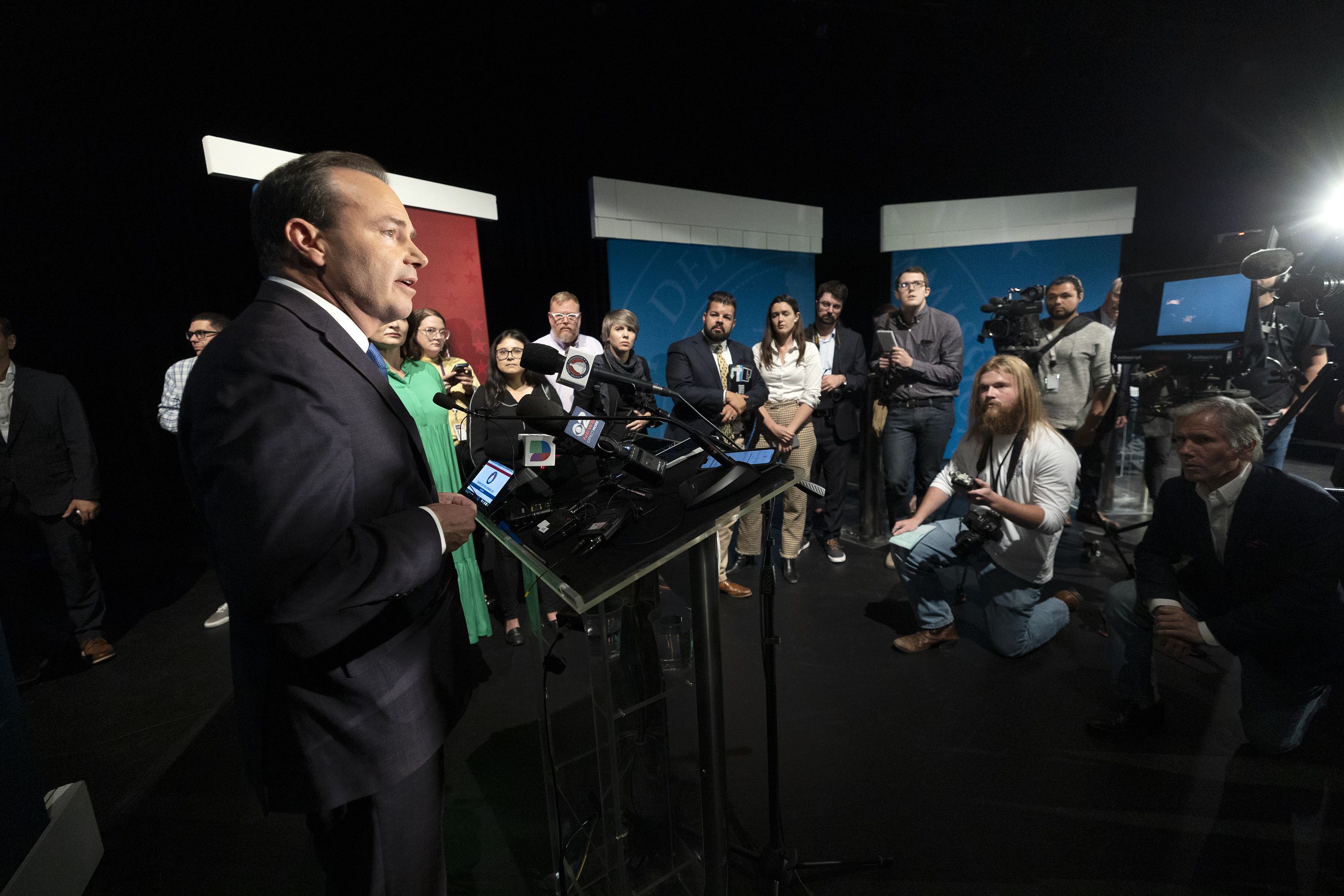 Sen. Mike Lee, R-Utah, talks with members of the media following a debate with Evan McMullin at Utah Valley University in Orem on Monday.