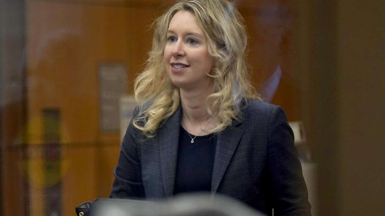 Former Theranos CEO Elizabeth Holmes arrives at federal court in San Jose, Calif., on Monday. A key witness in the January trial that led to multiple convictions for the disgraced Holmes was back on the stand Monday to revisit his testimony, part of an effort by Holmes' lawyers to secure a new trial for the 38-year-old Stanford dropout.