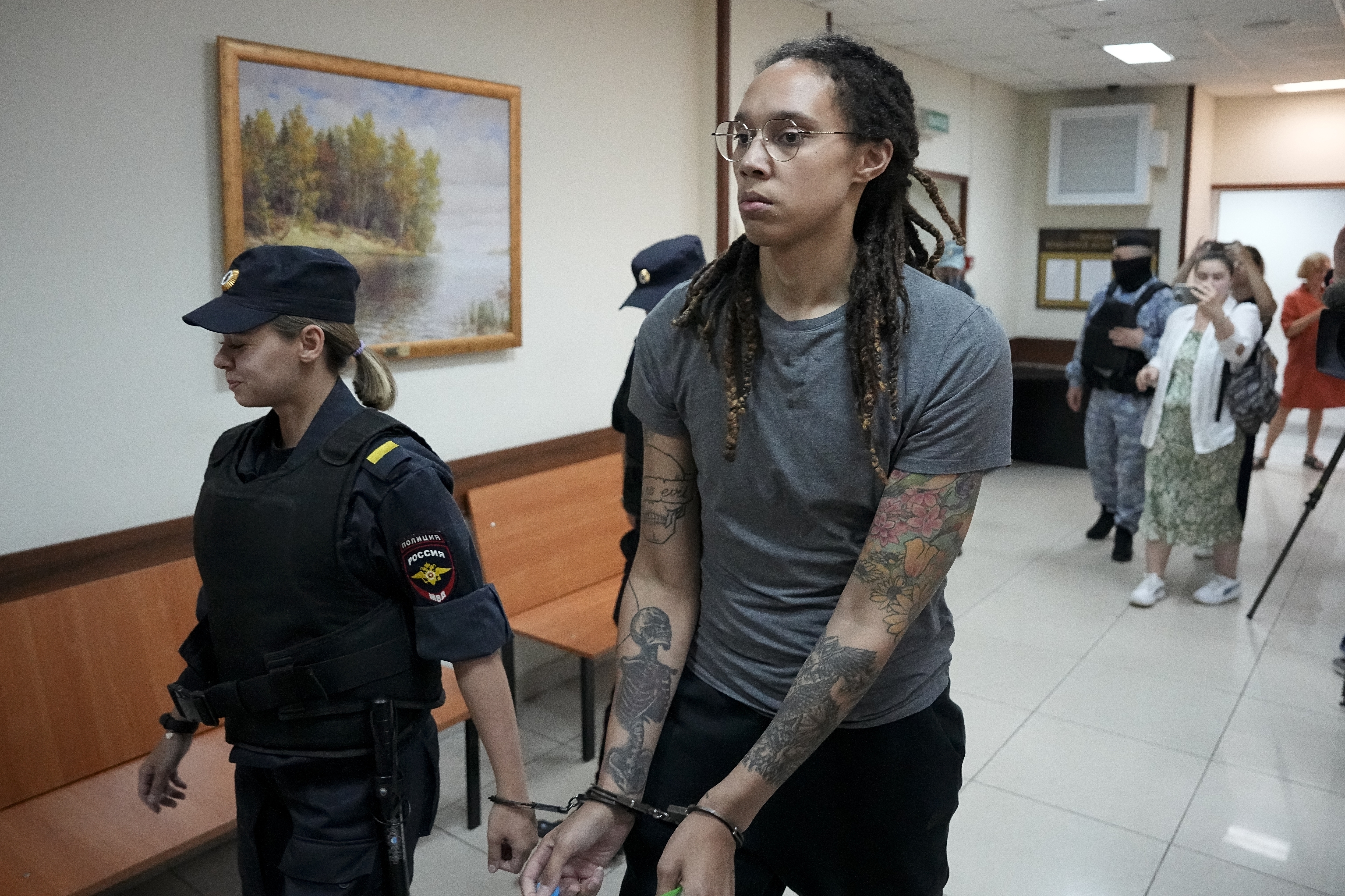 FILE - WNBA star and two-time Olympic gold medalist Brittney Griner is escorted from a court room after her last words, in Khimki just outside Moscow, Russia, on Aug. 4, 2022. The Moscow region's court on Monday Oct. 3, 2022 set a date for American basketball star Brittney Griner's appeal against her nine-year prison sentence for drug possession, scheduling the hearing for Oct. 25. 