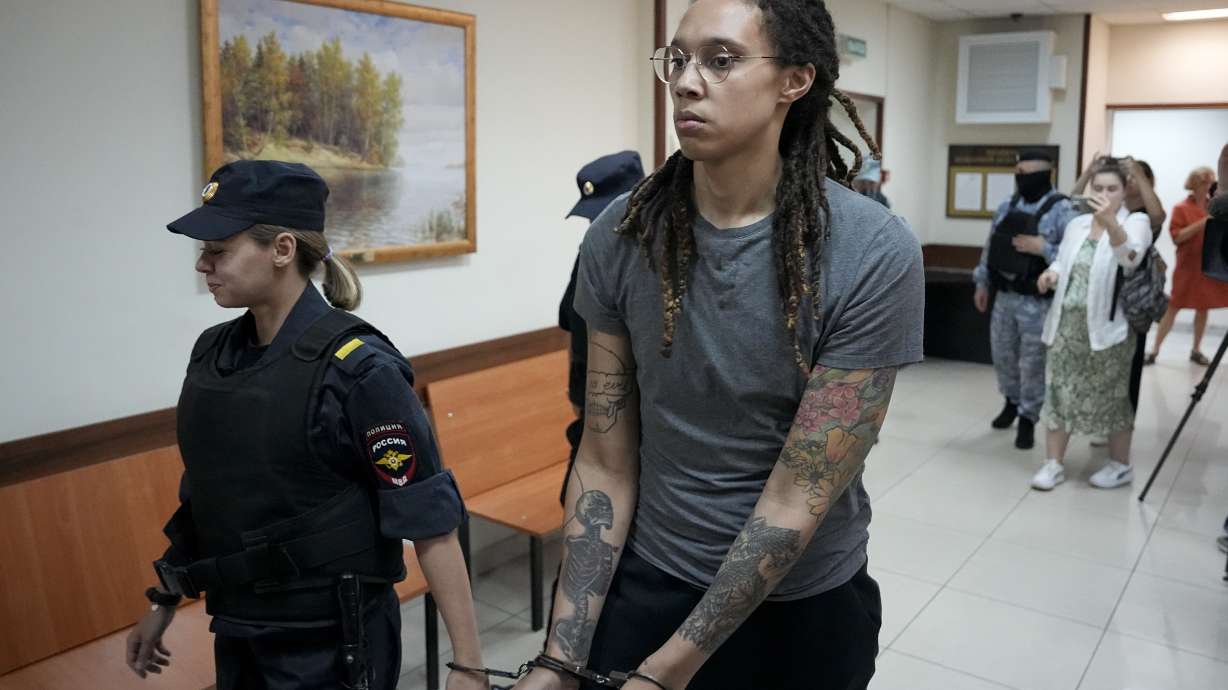 FILE - WNBA star and two-time Olympic gold medalist Brittney Griner is escorted from a court room after her last words, in Khimki just outside Moscow, Russia, on Aug. 4, 2022. The Moscow region's court on Monday Oct. 3, 2022 set a date for American basketball star Brittney Griner's appeal against her nine-year prison sentence for drug possession, scheduling the hearing for Oct. 25.