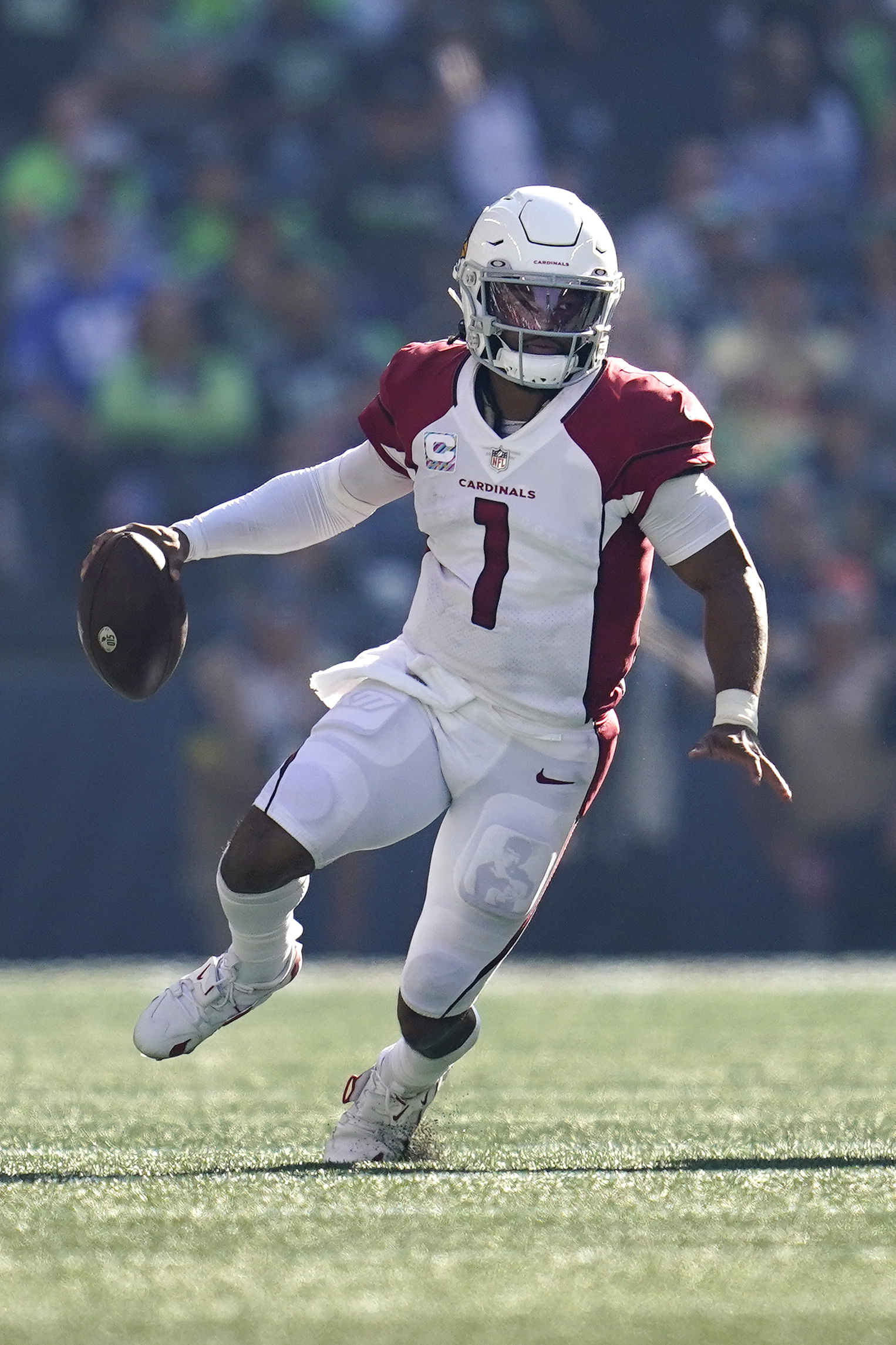 Arizona Cardinals quarterback Kyler Murray (1) runs with the ball during the second half of an NFL football game against the Seattle Seahawks, Sunday, Oct. 16, 2022, in Seattle. 