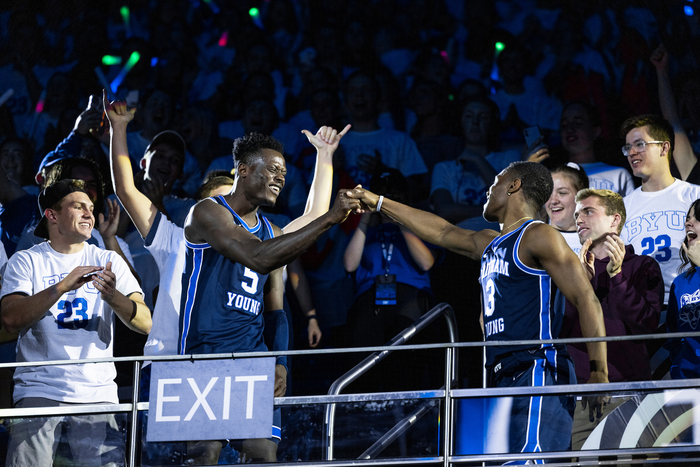 BYU guard Rudi Williams, right, and senior wing Gideon George bump fists during Midnight Madness to kick off the new basketball season for men’s and women’s basketball, Thursday, Oct. 14, 2022 at the Marriott Center in Provo.