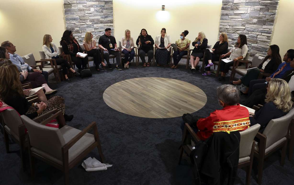Low-income and underserved community health care officials and providers gather during a National Governors Association event at Sacred Circle Healthcare in Salt Lake City on Wednesday.