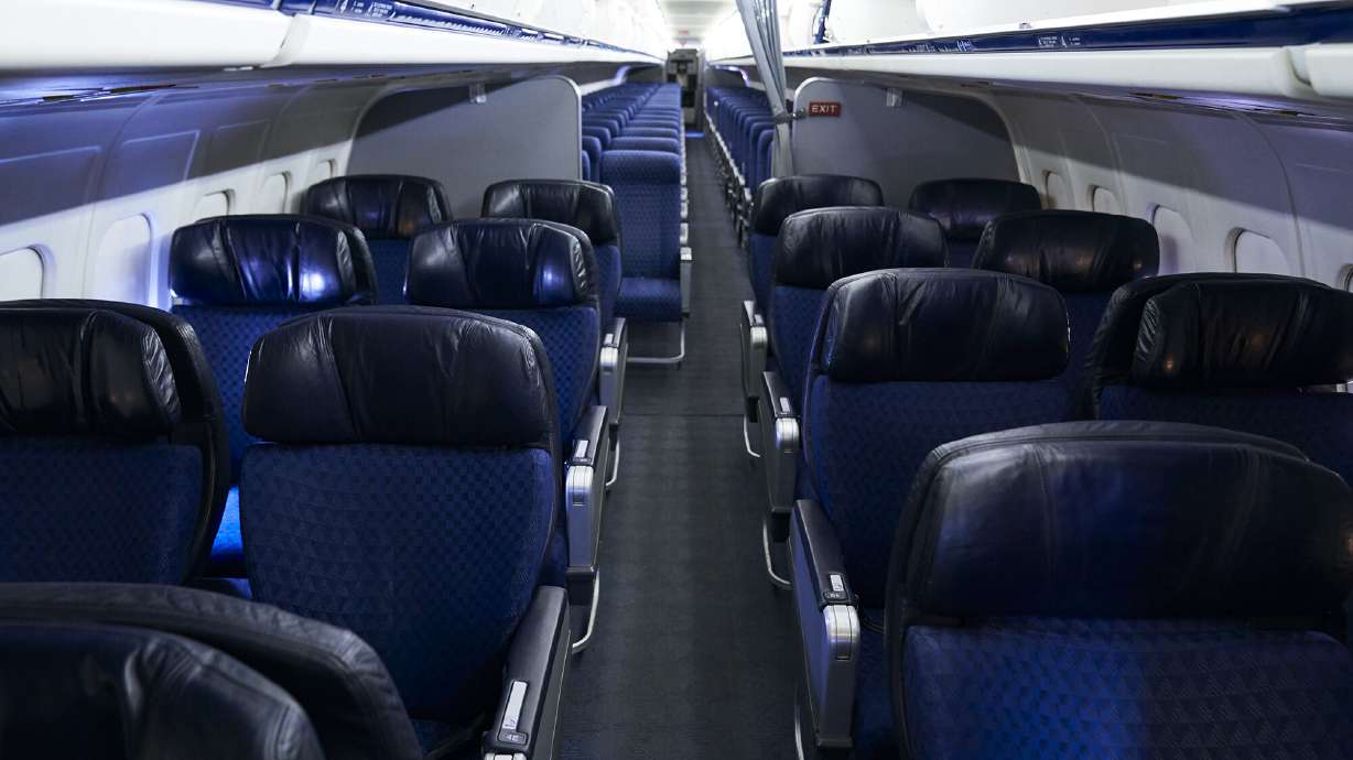 American Airlines is dropping its first class cabins for more business class seats. Pictured are first and economy class cabins of an American Airlines aircraft at Dallas/Fort Worth International Airport on Sept. 1, 2019.