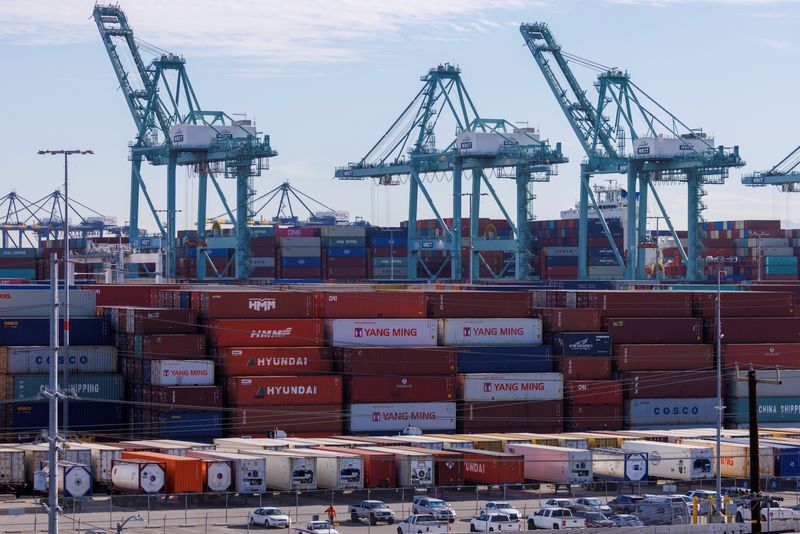 Stacked containers and cranes are shown at the Port of Los Angeles Nov. 22, 2021. After more than two years of surging demand, the volume of container imports coming through U.S. ports has tumbled sharply, raising questions about where a sector once tracked as a supply-chain stress point will hit bottom.