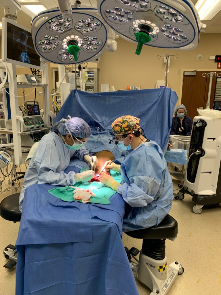 Dr. Deramo, right, performs targeted muscle reinnervation surgery to reconnect severed nerves and improve the quality of life for amputees.