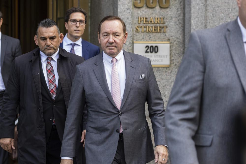 Actor Kevin Spacey, center, leaves court, Monday in New York. Spacey testified that he never made a sexual pass at the actor Anthony Rapp, who has sued, claiming the Academy Award-winning actor tried to take him to bed when he was 14. Spacey was acquitted by a jury.