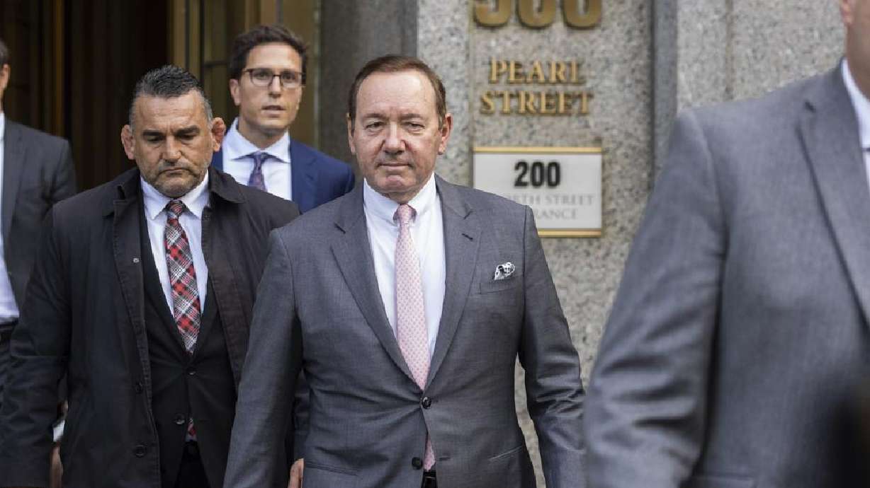 Actor Kevin Spacey, center, leaves court, Monday in New York. Spacey testified that he never made a sexual pass at the actor Anthony Rapp, who has sued, claiming the Academy Award-winning actor tried to take him to bed when he was 14. Spacey was acquitted by a jury.