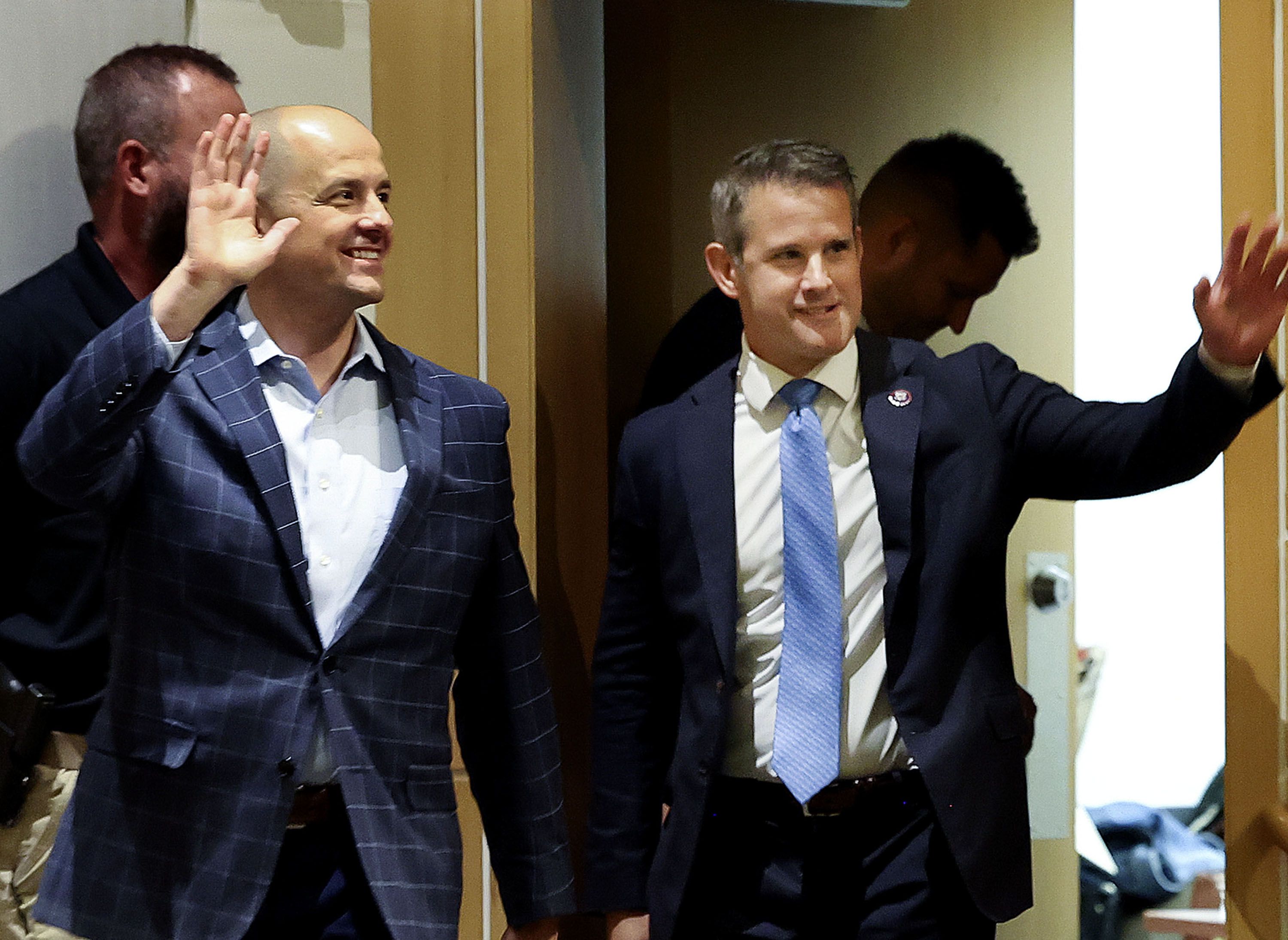 Evan McMullin, an independent candidate for U.S. Senate, left, and Rep. Adam Kinzinger, R-Ill., a member of U.S. House Jan. 6 Committee, acknowledge the audience’s applause before a forum on democracy at the Salt Lake City Public Library on Thursday.
