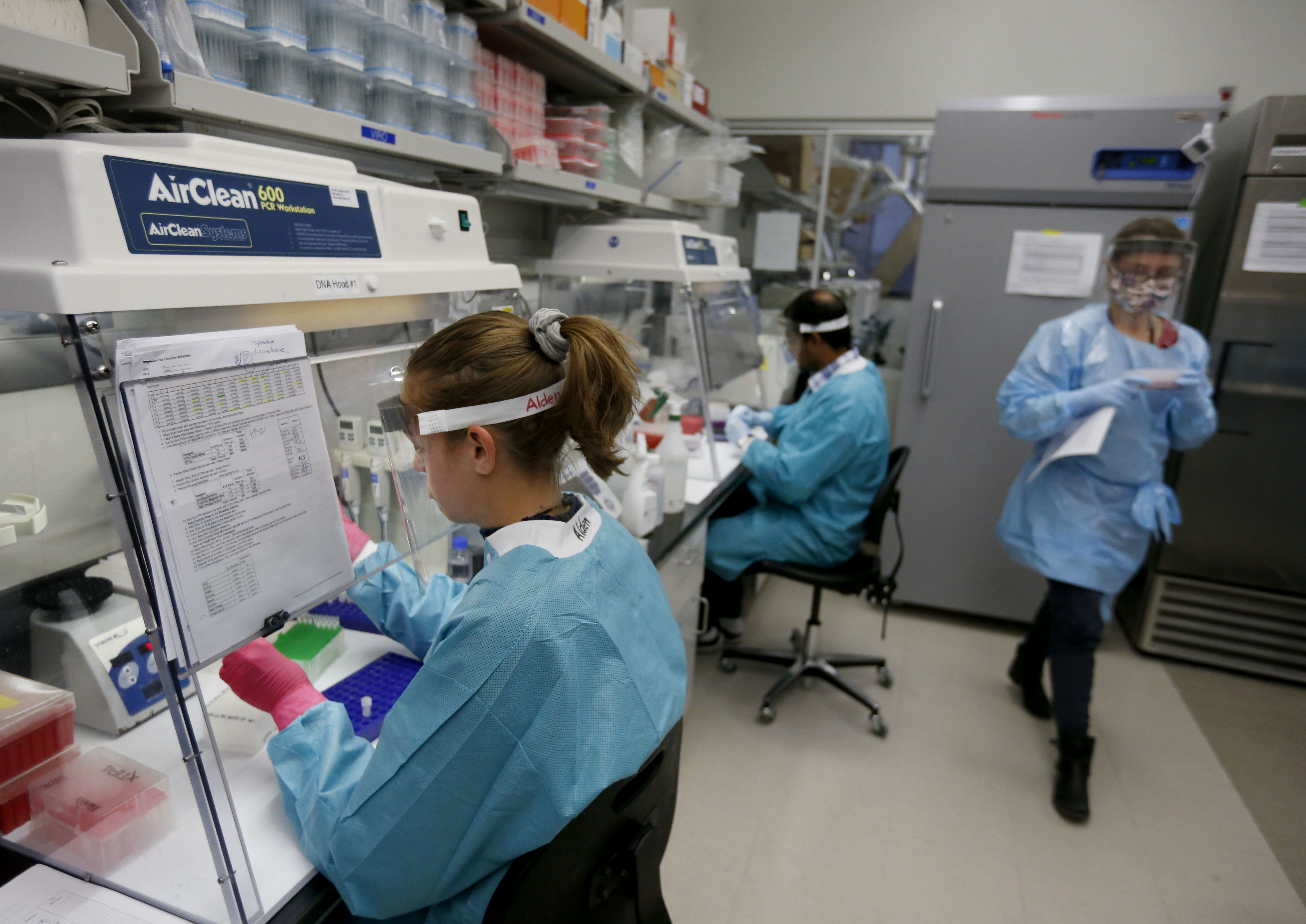 Microbiologists and lab technicians work with SARS-CoV-2 — the coronavirus that causes COVID-19 — samples in the infectious disease lab at Utah Public Health Laboratory in Taylorsville on Friday, Nov. 13, 2020.