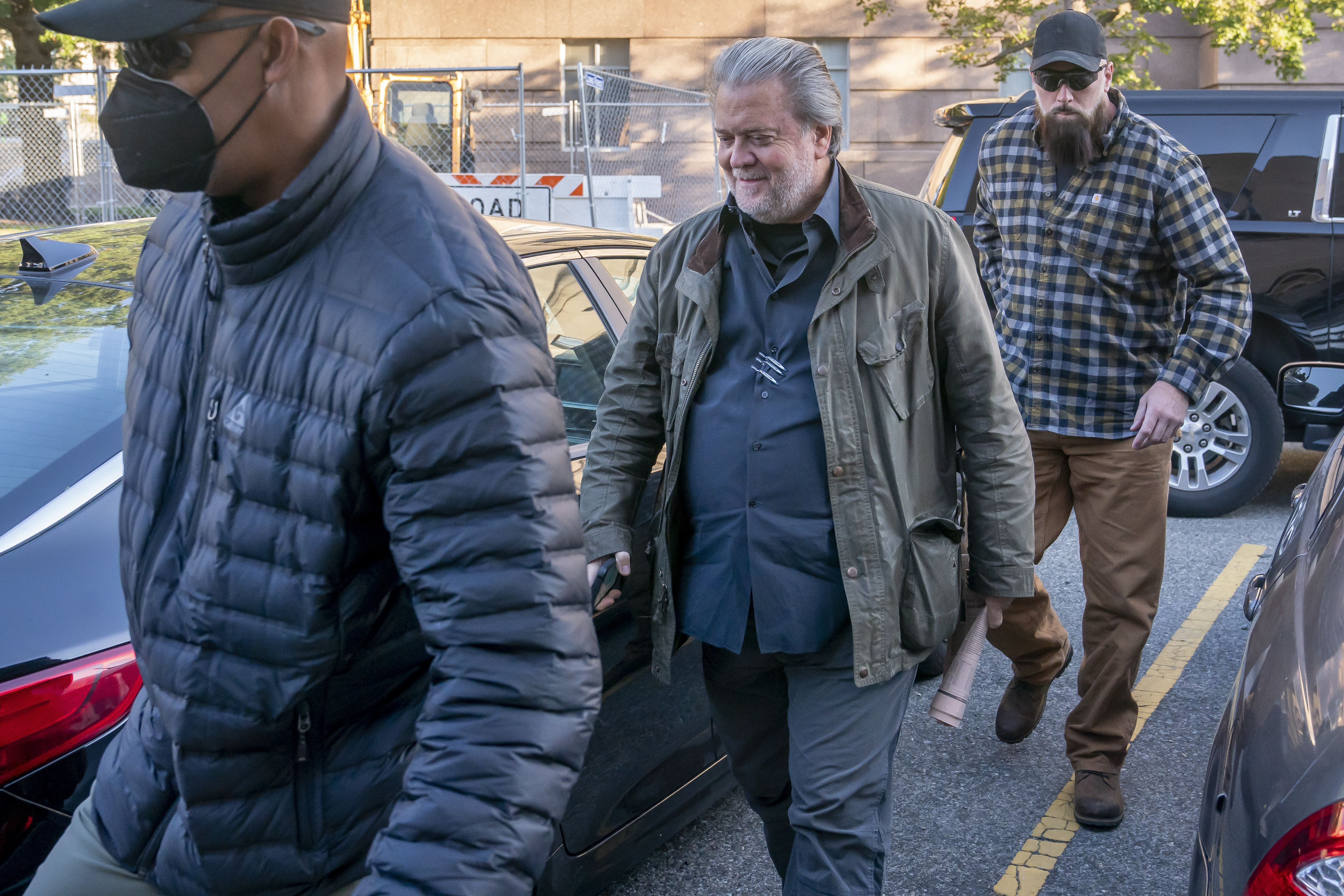 Steve Bannon, center, a longtime ally of former President Donald Trump, convicted of contempt of Congress, arrives at federal court for a sentencing hearing, Friday in Washington.