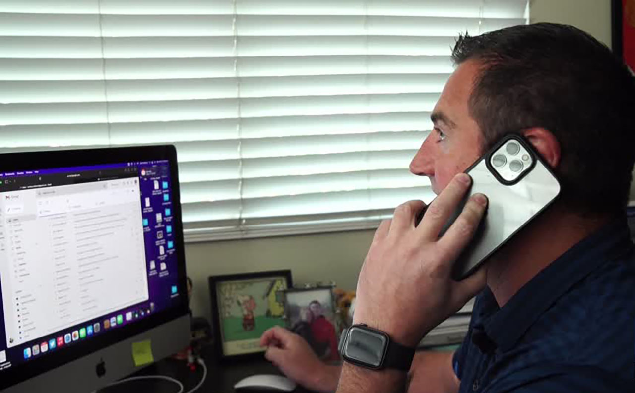 Zach Robinson of Sandy talks on the phone. Important phone calls dismissed as spam can sometimes be important, he learned.