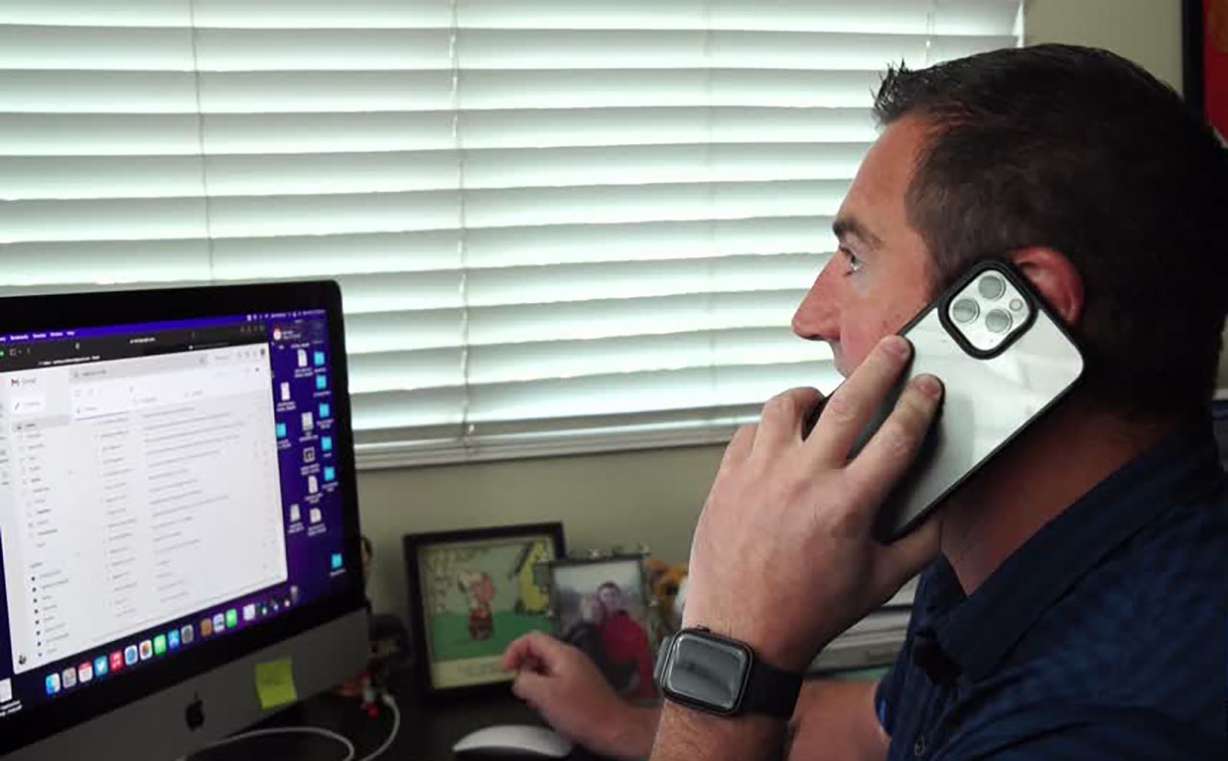 Zach Robinson of Sandy talks on the phone. Important phone calls dismissed as spam can sometimes be important, he learned.