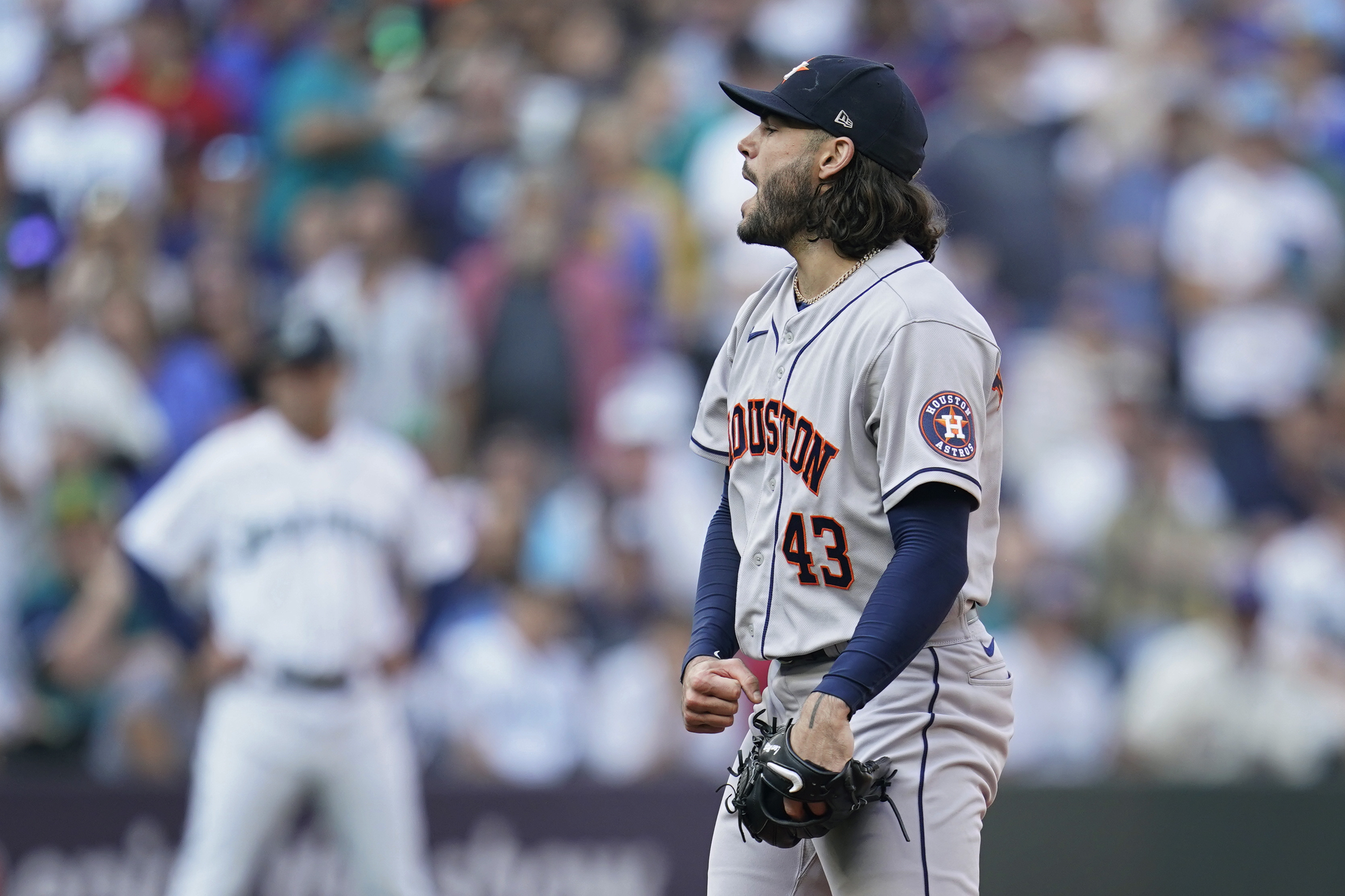 Houston Astros starting pitcher Lance McCullers Jr. (43) reacts after striking out Seattle Mariners catcher Cal Raleigh during the sixth inning in Game 3 of an American League Division Series baseball game Saturday, Oct. 15, 2022, in Seattle. 