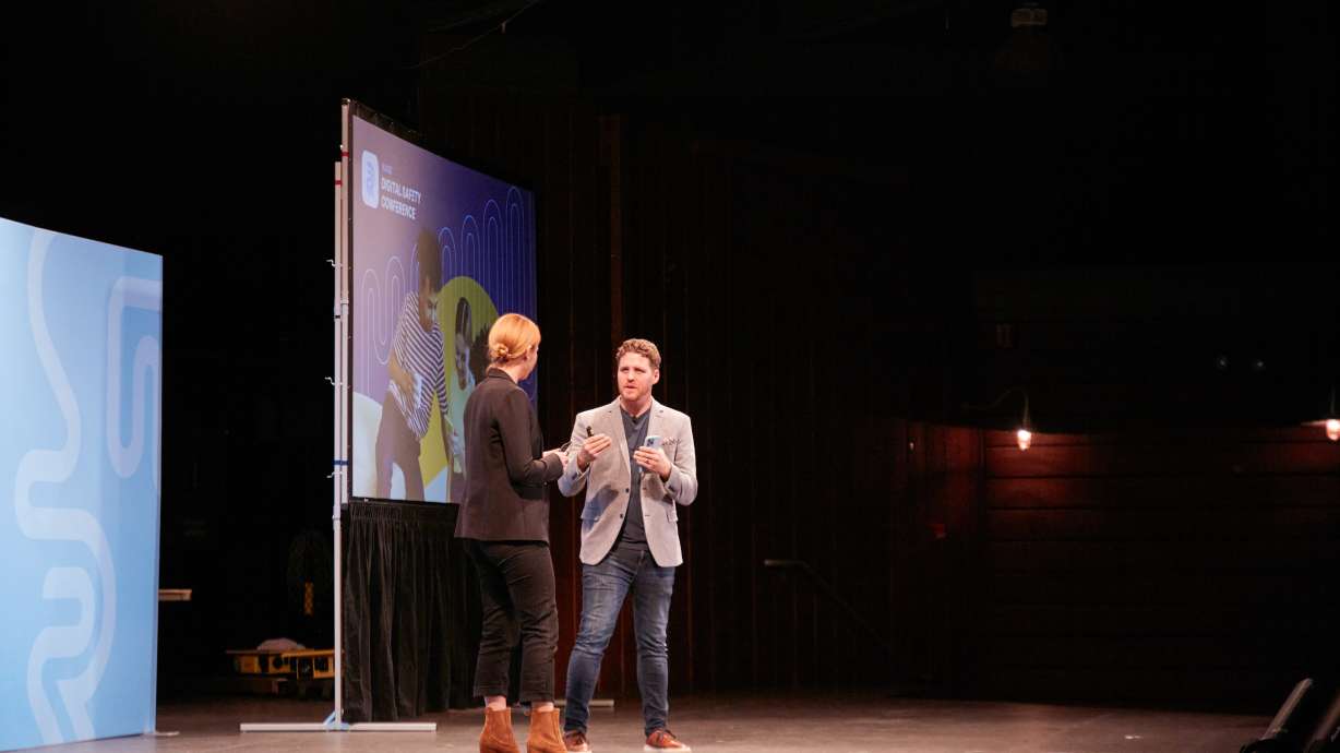 Elizabeth Smart and Clay Olsen onstage at the Raise Digital Safety Conference in Lehi on Oct. 18. Olsen partnered with the Malouf Foundation to create the Raise parenting app — a free resource to help parents navigate online safety.