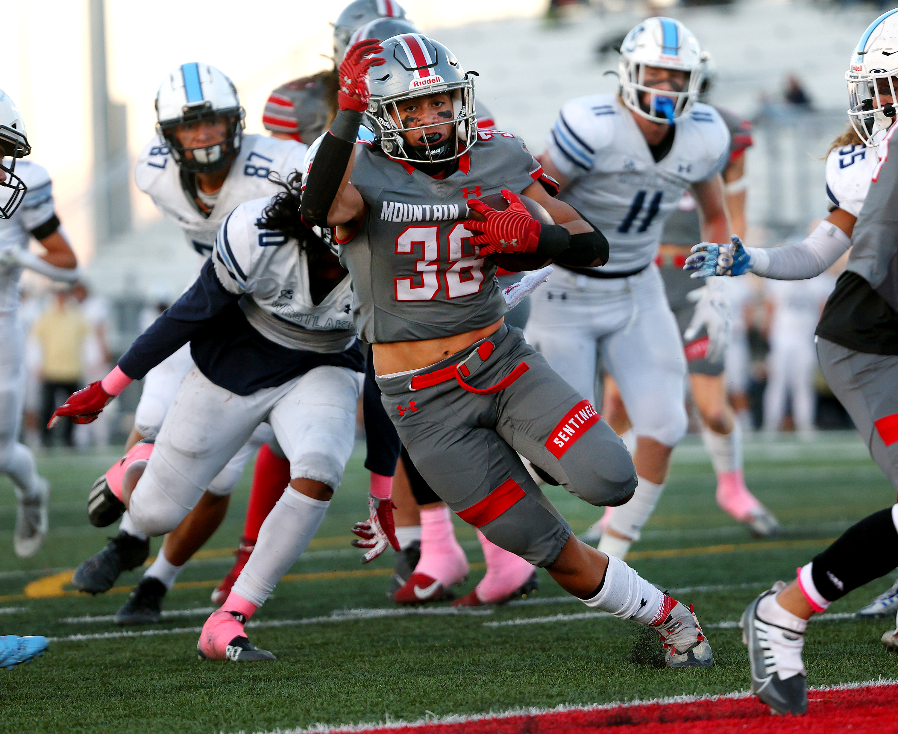 Mountain Ridge’s Semisi Kinikini heads into the end zone for a touchdown against Westlake in the first round of the playoffs in Herriman on Friday, Oct. 21, 2022.