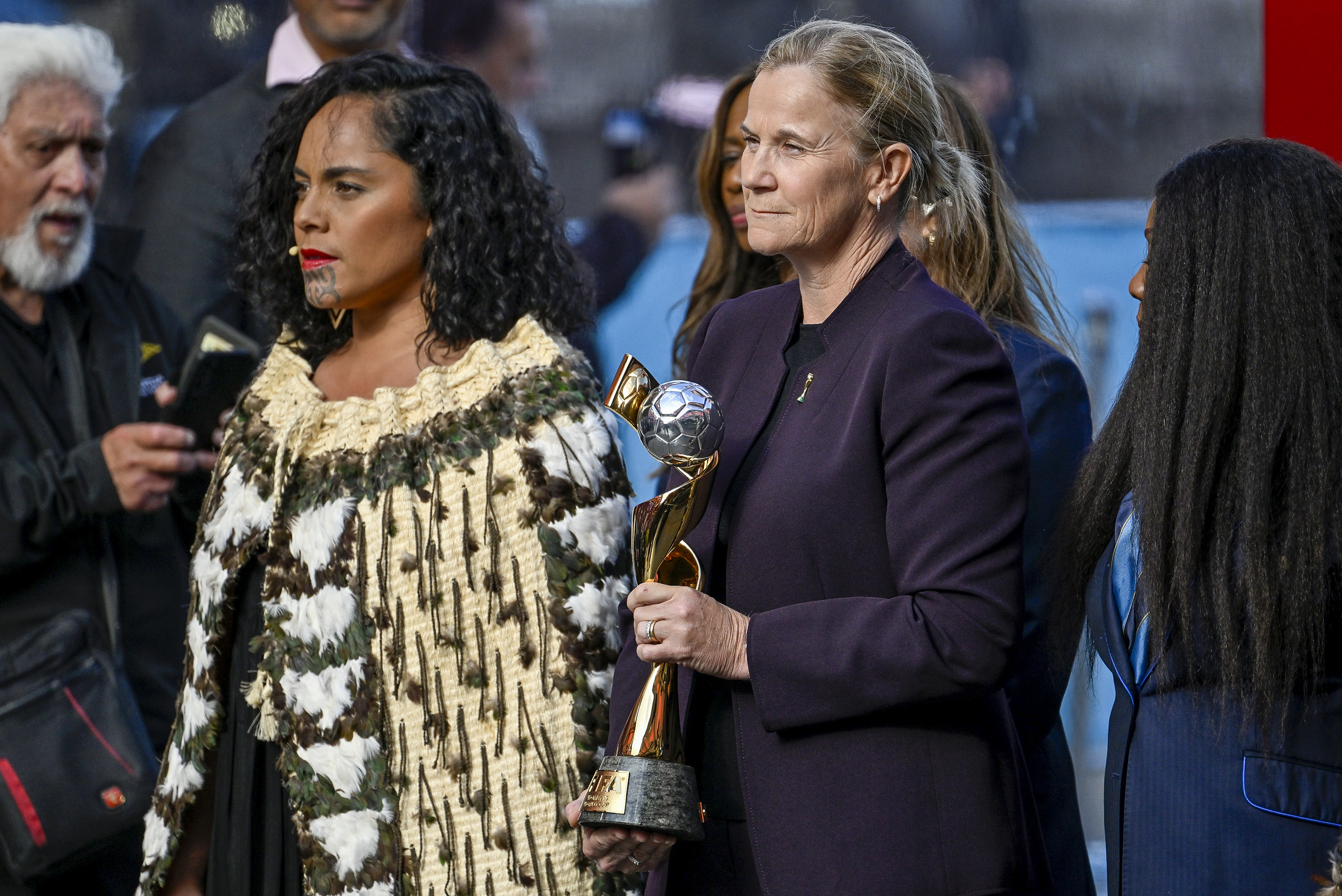 Jill Ellis, former United States team coach, carries the FIFA Women's World Cup Trophy during the Powhiri ceremony ahead of the FIFA Women's World Cup 2023 draw in Auckland, New Zealand, Friday OCT. 21, 2022. The draw for the tournament to be held in Australia and New Zealand in 2023 will be held on Saturday, Oct. 22. 