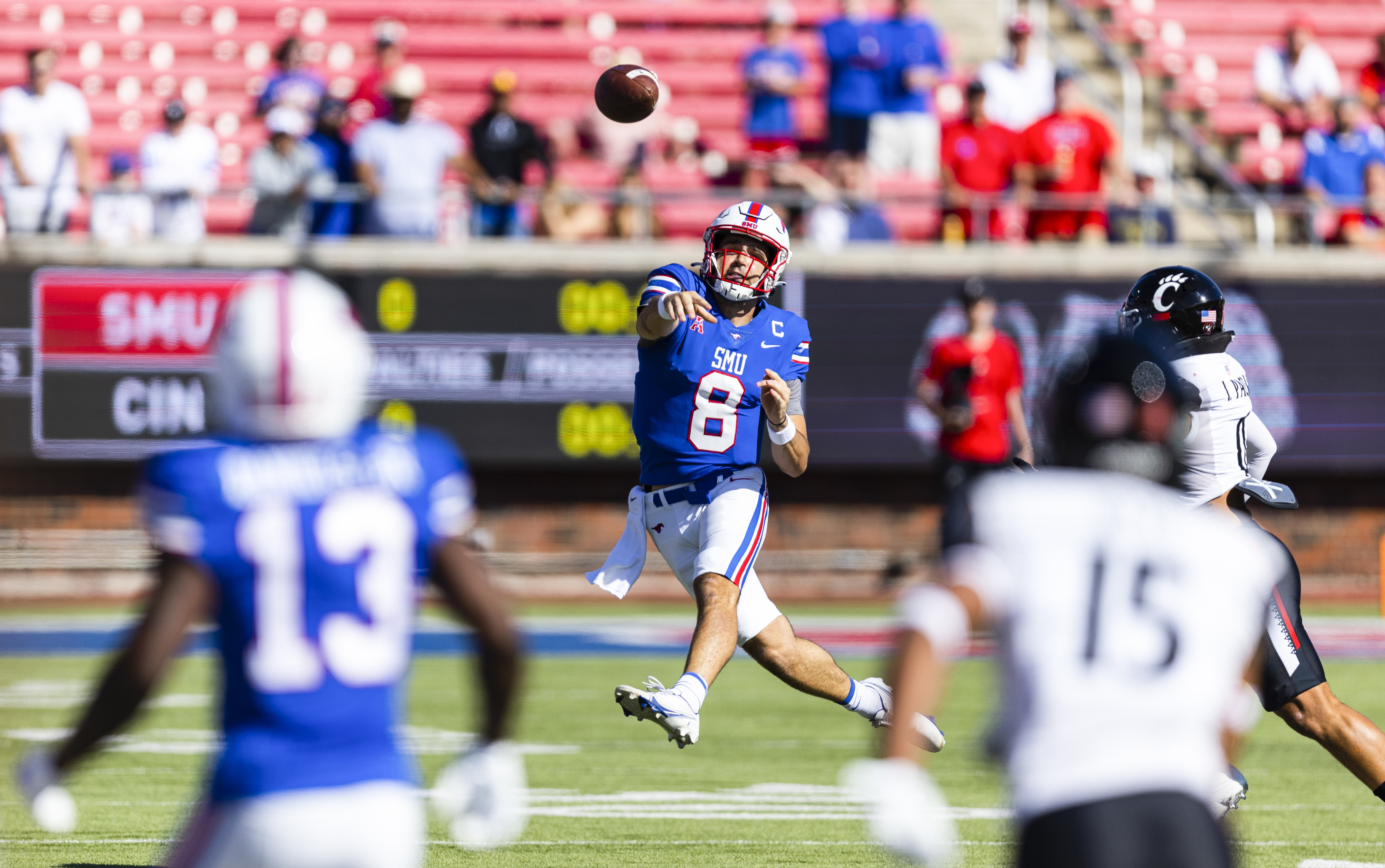 SMU quarterback Tanner Mordecai (8) throws to SMU wide receiver Roderick Daniels Jr. (13) during the first half of an NCAA college football game against Cincinnati Saturday, Oct. 22, 2022, in Dallas.