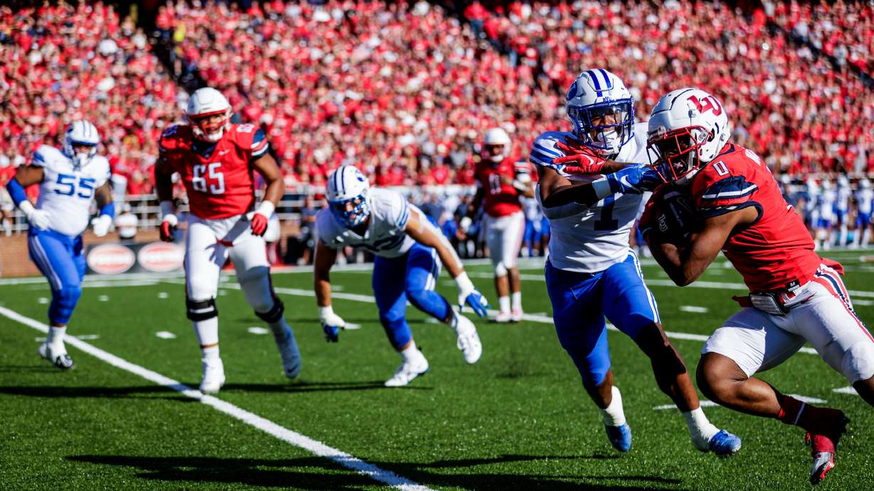 BYU tries to stop Liberty's rushing attack, Saturday, Oct. 22, 2022 at Williams Stadium in Lynchburg, Virginia.