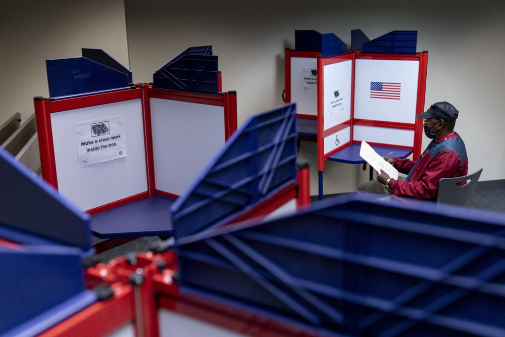 Cornelius Whiting fills out his ballot at an early voting location in Alexandria, Va., on Sept. 26. Republican activists who believe the 2020 election was stolen from former President Donald Trump have crafted a plan that, in their telling, will thwart cheating in this year’s midterm elections.
