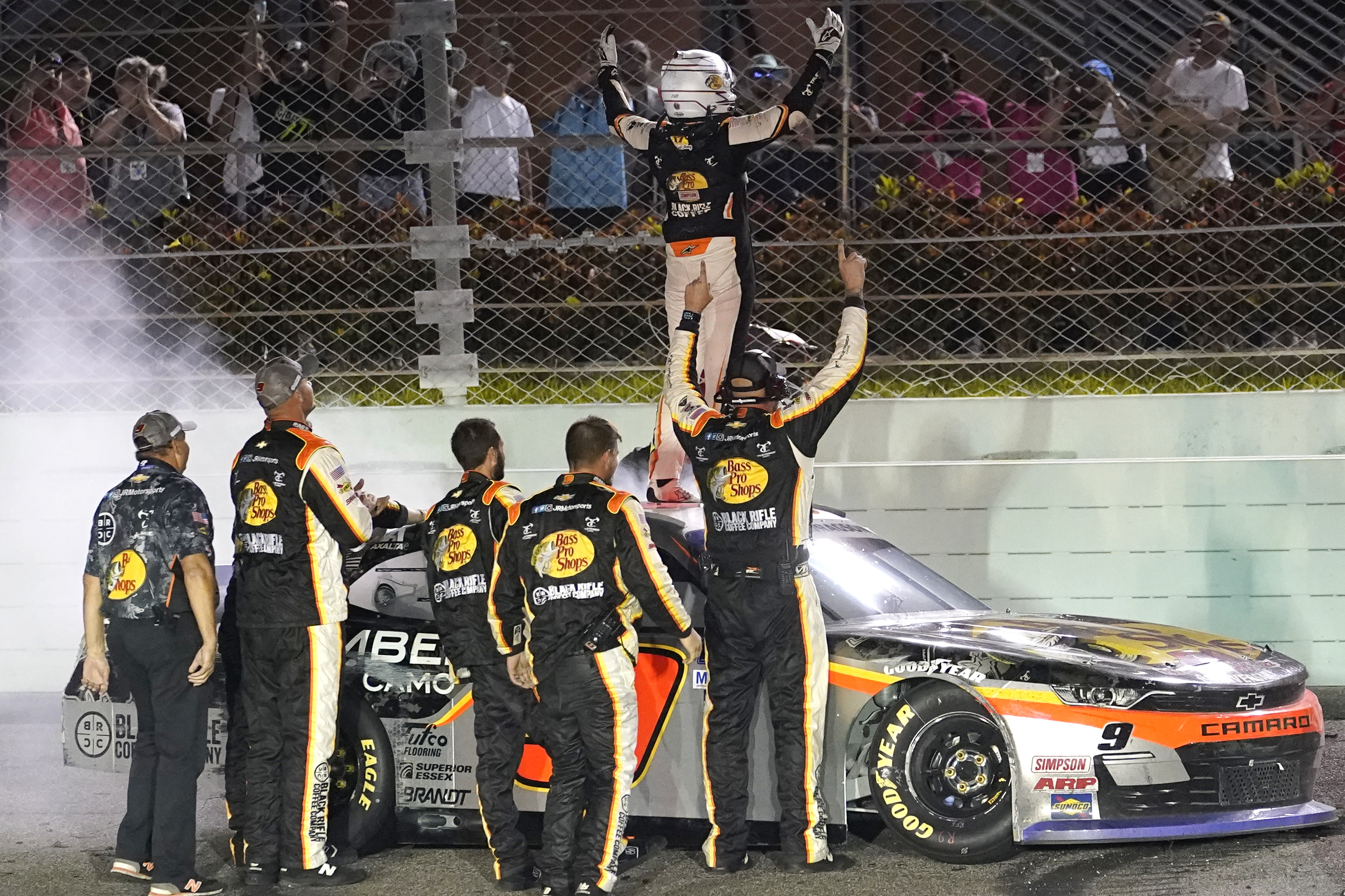 Noah Gragson celebrates on the roof of his car after winning the NASCAR Xfinity Series auto race at Homestead-Miami Speedway, Saturday, Oct. 22, 2022, in Homestead, Fla.