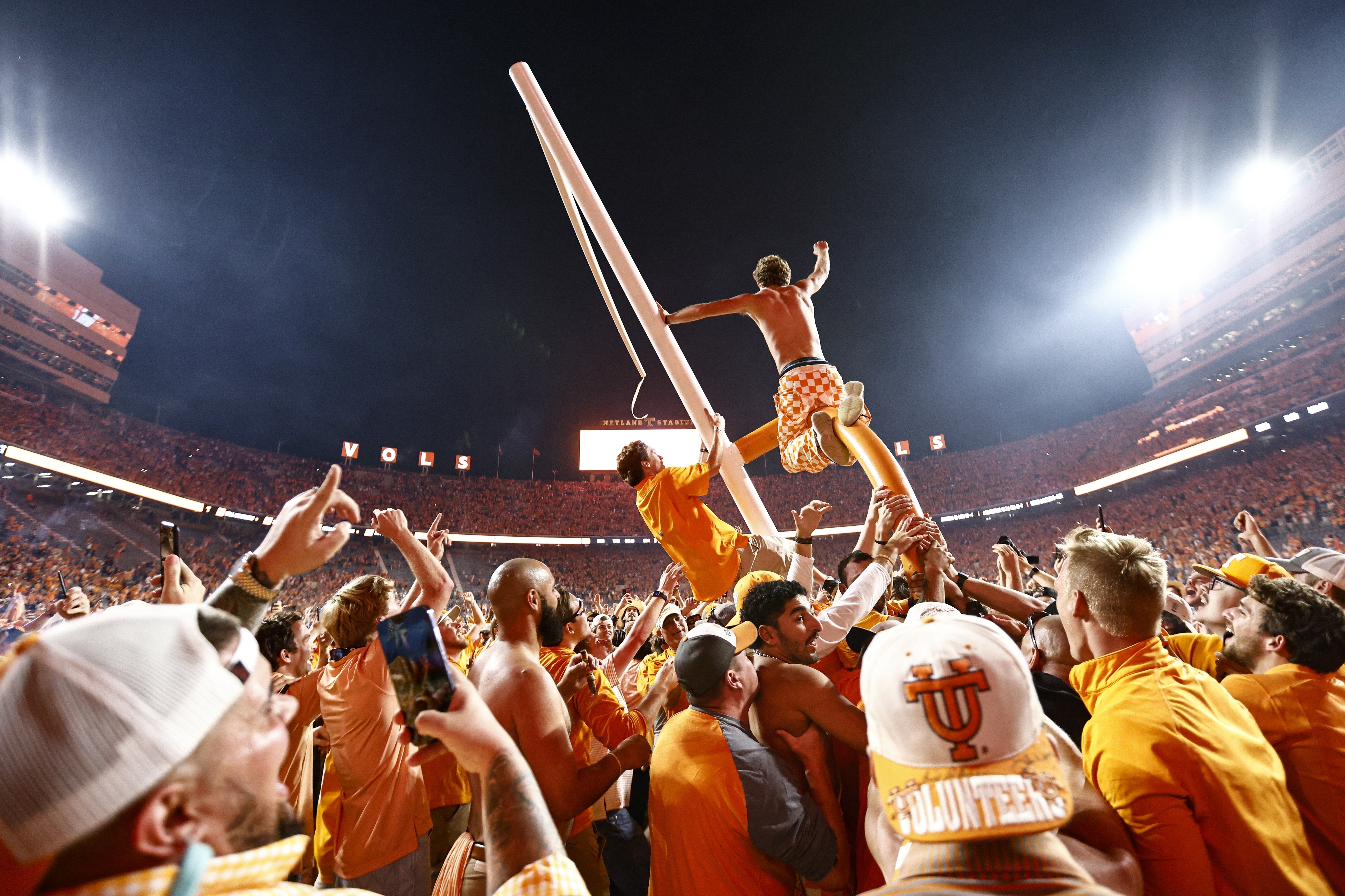 Tennessee fans tear down the goal post after defeating Alabama 52-49 in an NCAA college football game Saturday, Oct. 15, 2022, in Knoxville, Tenn. 