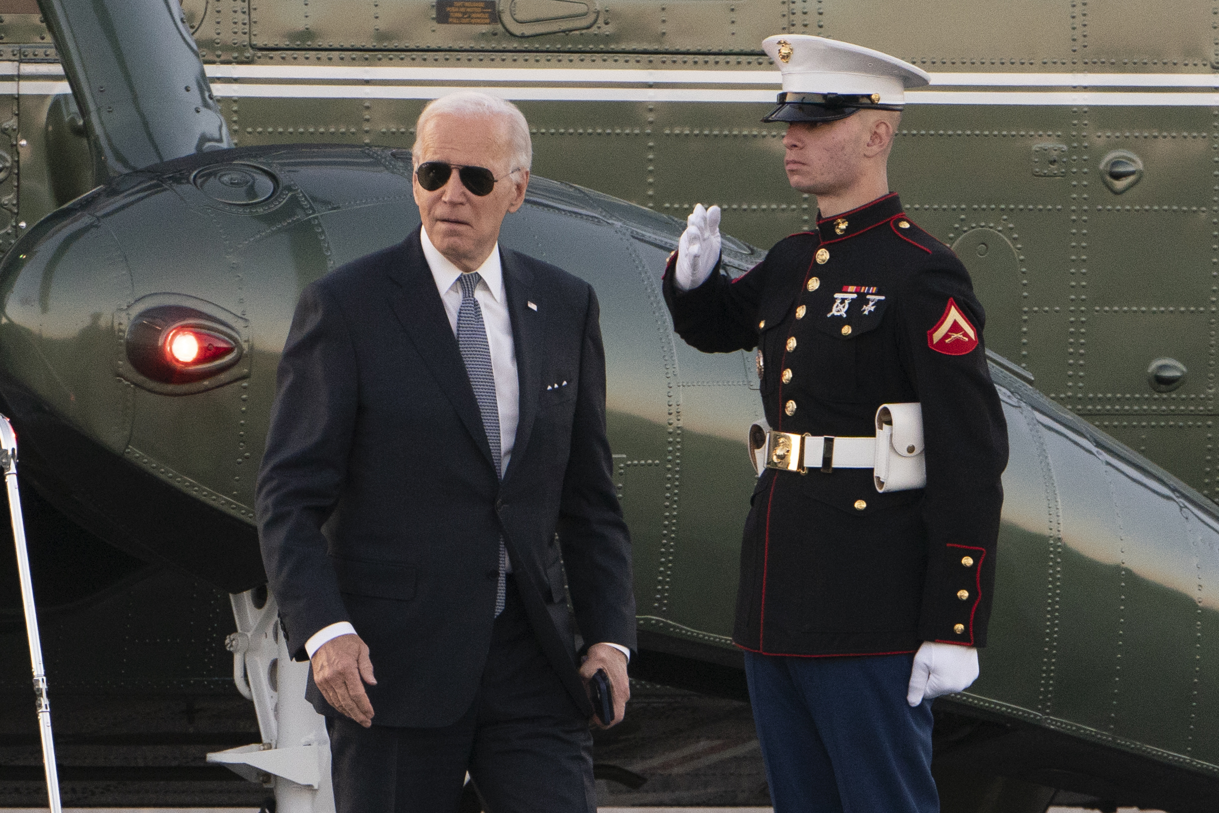 President Joe Biden walks from Marine One upon arrival at the Gordons Pond in Rehoboth Beach, Del., Friday.