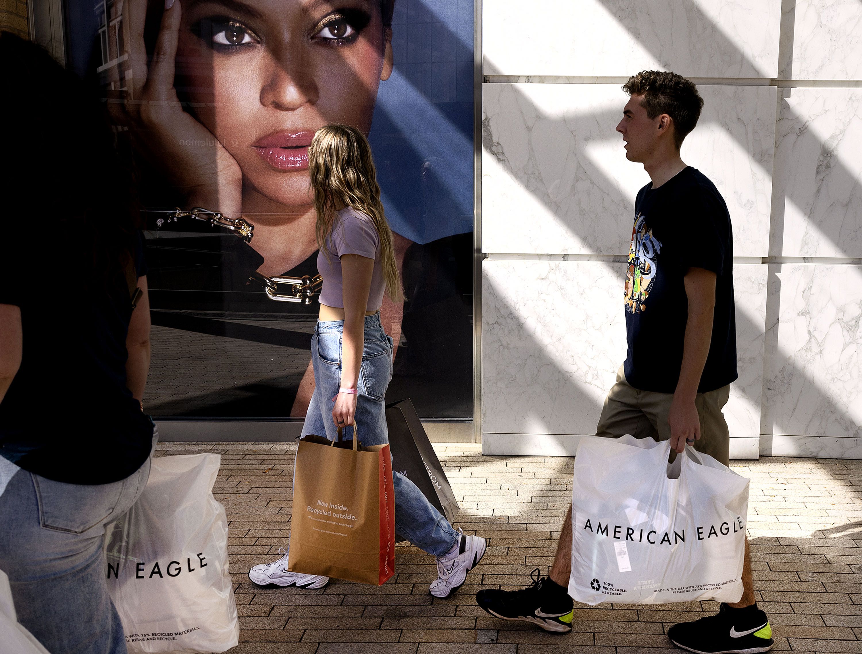 Michelle Bishop, left, and her children, Londyn and Logan, shop at City Creek Center in Salt Lake City on Thursday. Results from a new Deseret News/Hinckley Institute of Politics poll finds most Utahns are planning on spending about the same or more on holiday gifts as they did last year, even as most are also concerned about inflation and the potential for a looming recession.