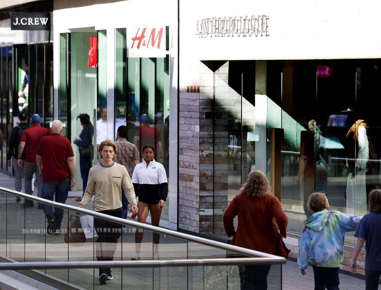 People walk through City Creek Center in Salt Lake City on Thursday.