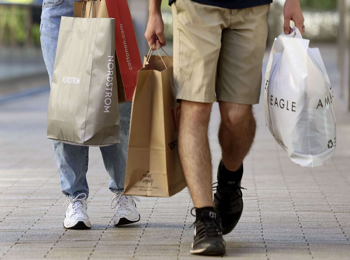 People walk through City Creek Center in Salt Lake City on Thursday.